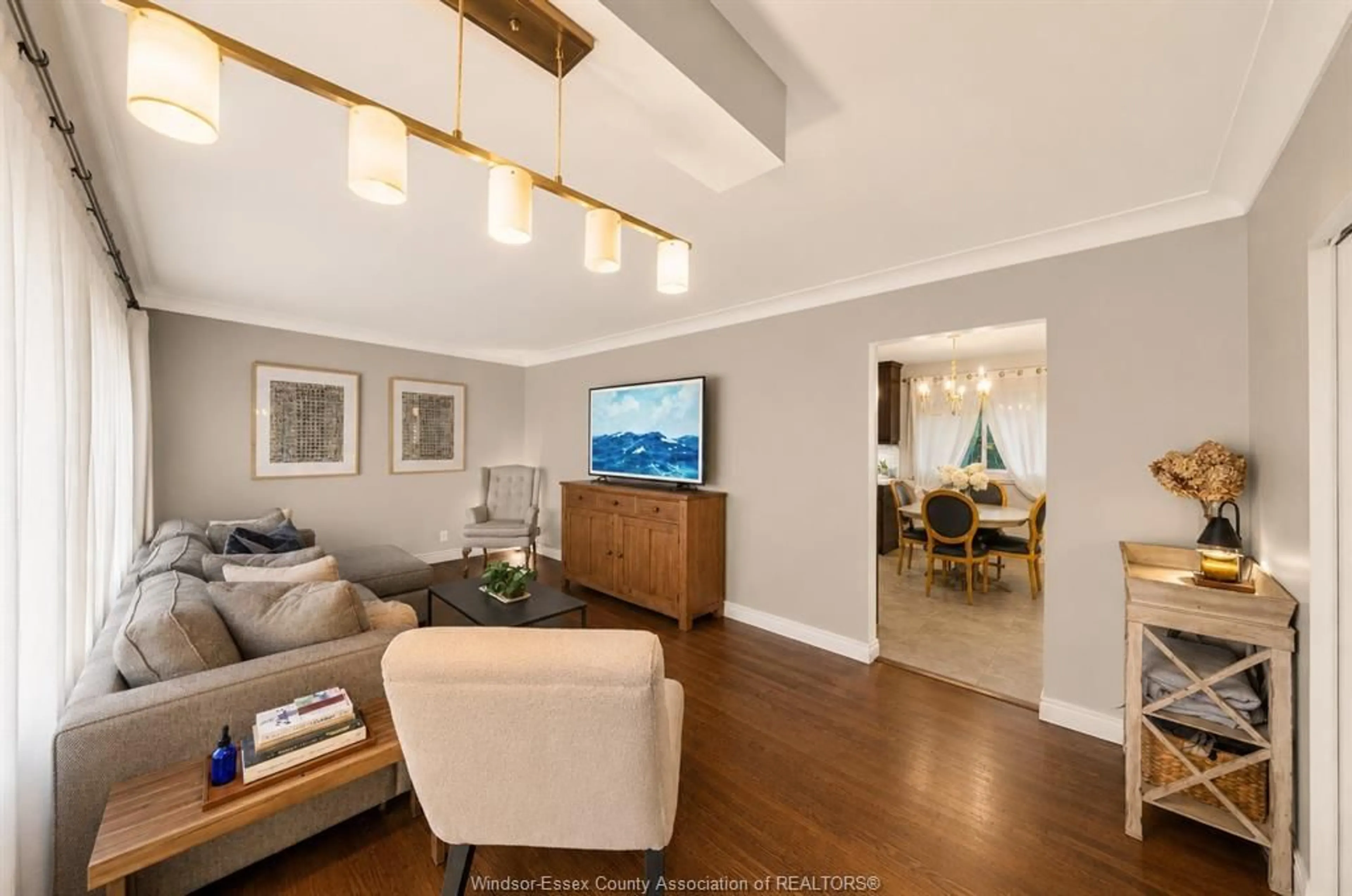 Living room with furniture, wood/laminate floor for 4255 LONGFELLOW, Windsor Ontario N9G 2B5