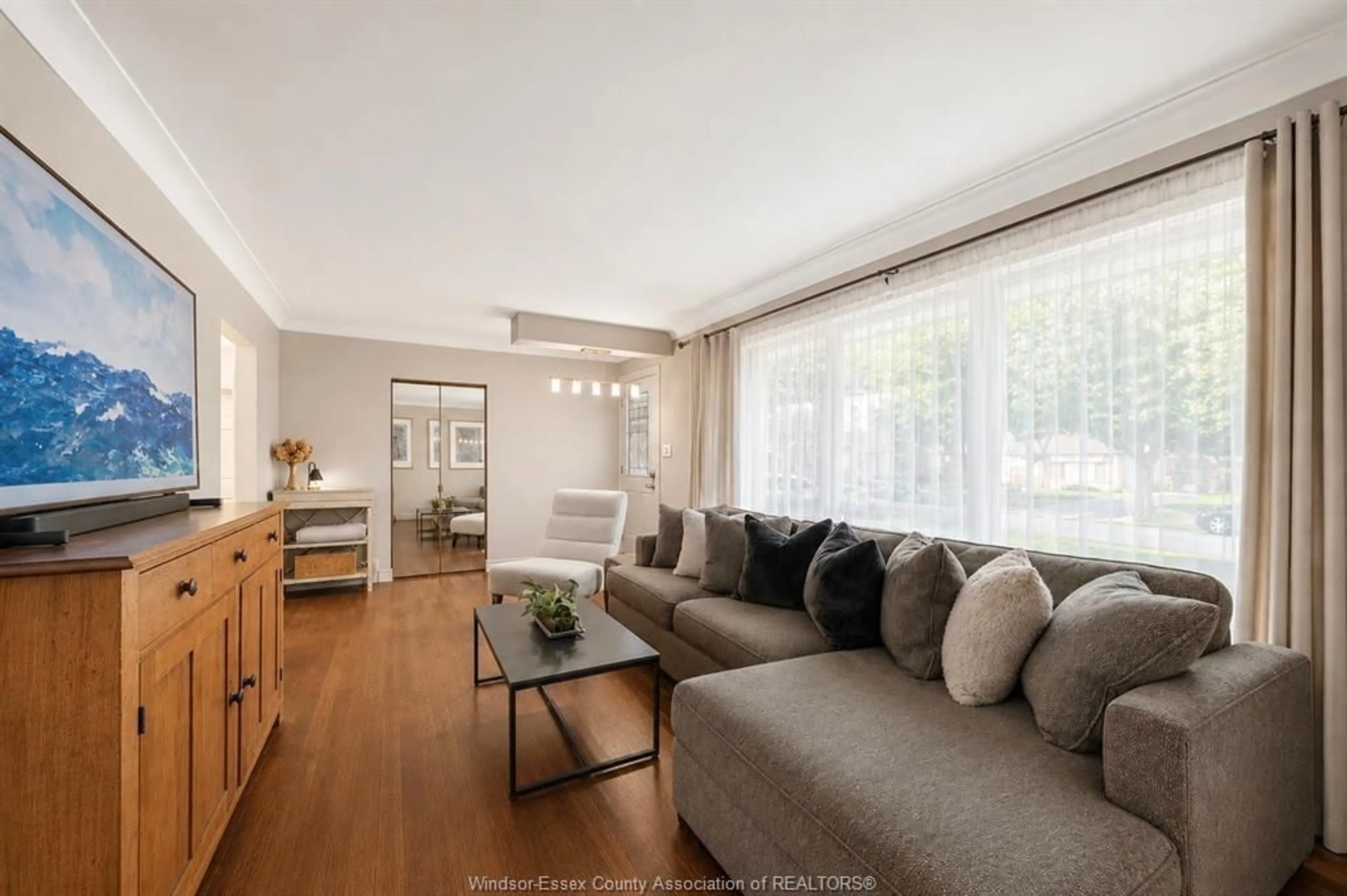 Living room with furniture, wood/laminate floor for 4255 LONGFELLOW, Windsor Ontario N9G 2B5
