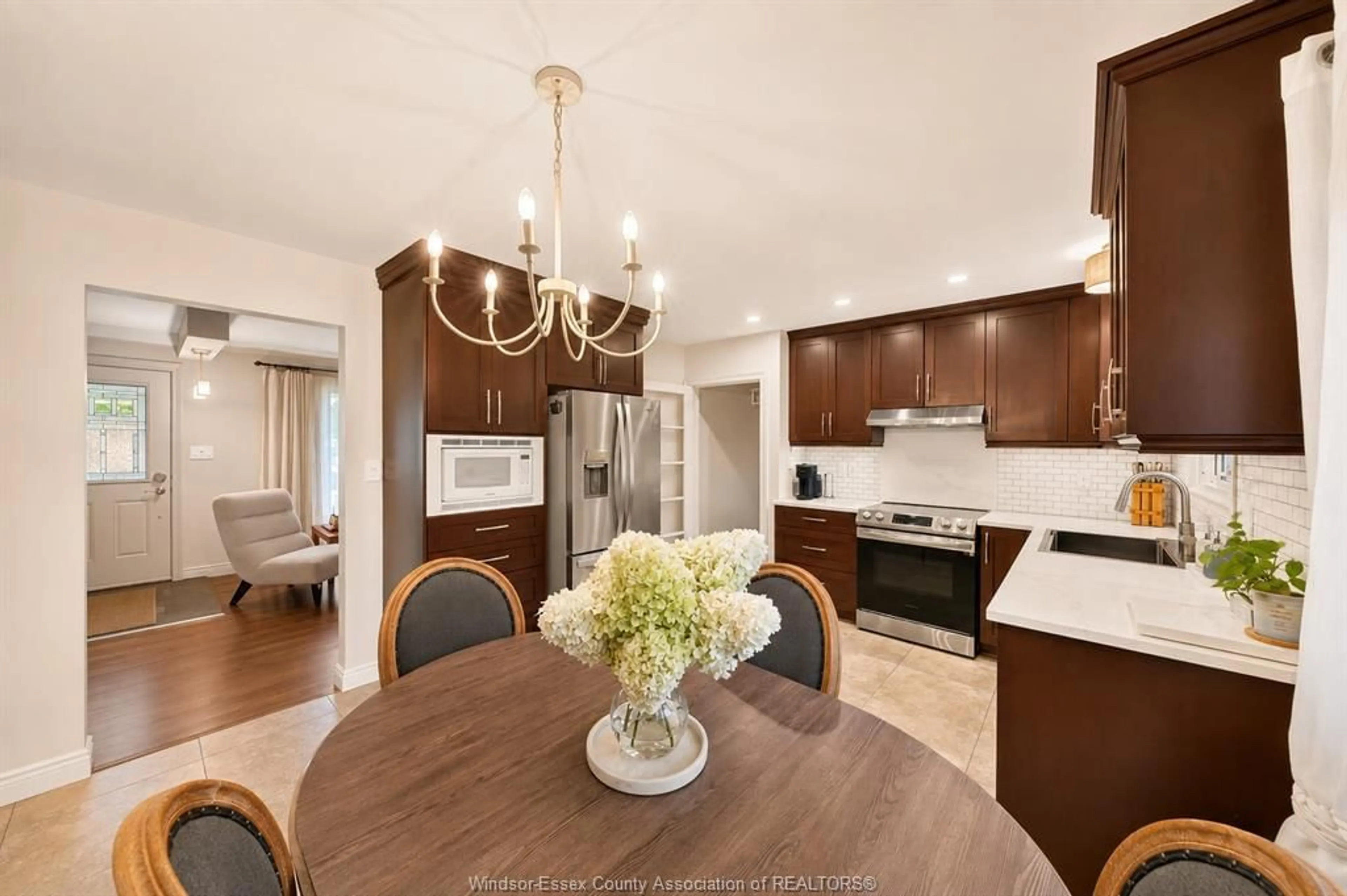 Open concept kitchen, wood/laminate floor for 4255 LONGFELLOW, Windsor Ontario N9G 2B5