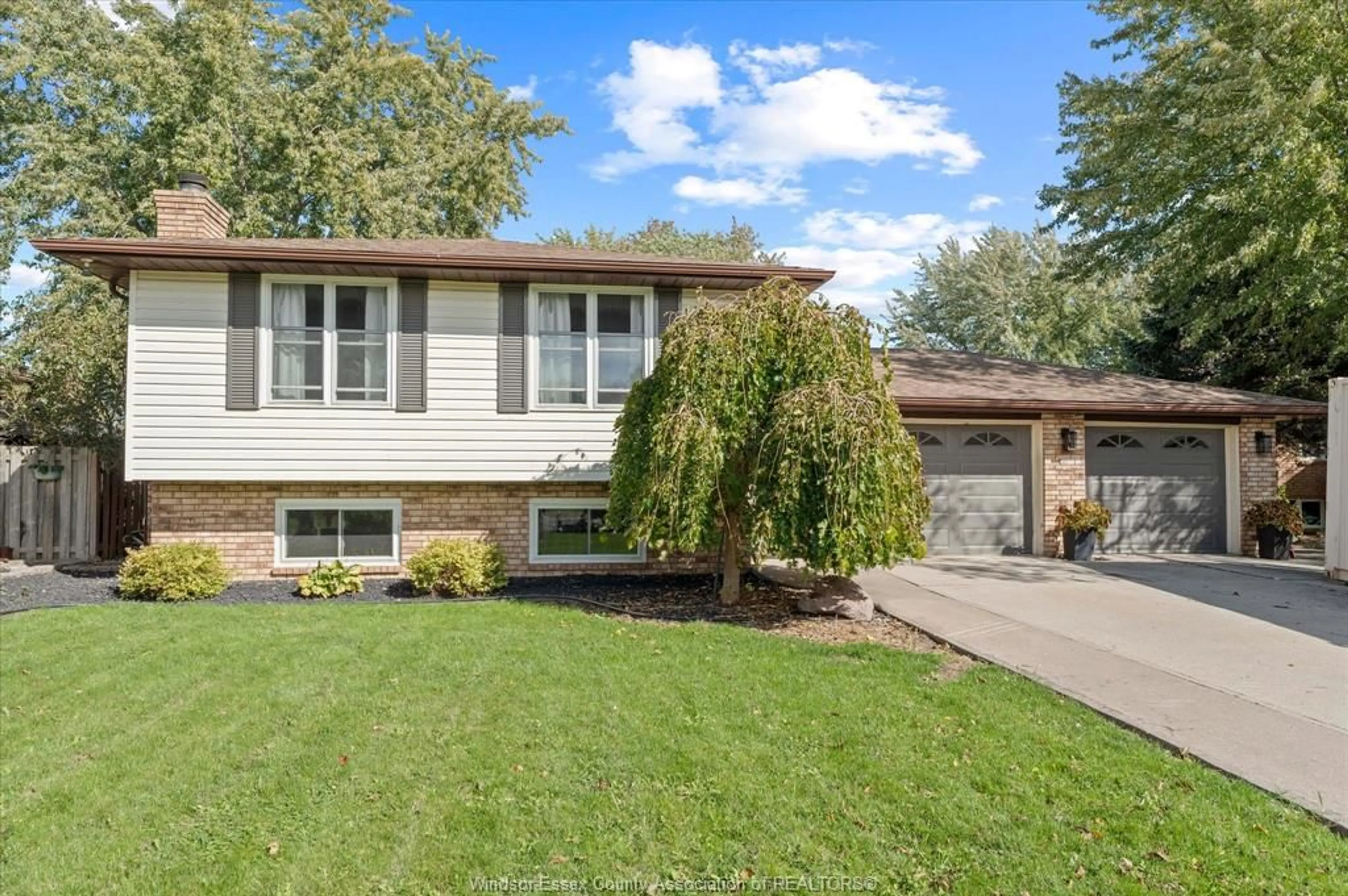 Home with vinyl exterior material, street for 232 GREENWOOD Cres, Lakeshore Ontario N8L 1C4
