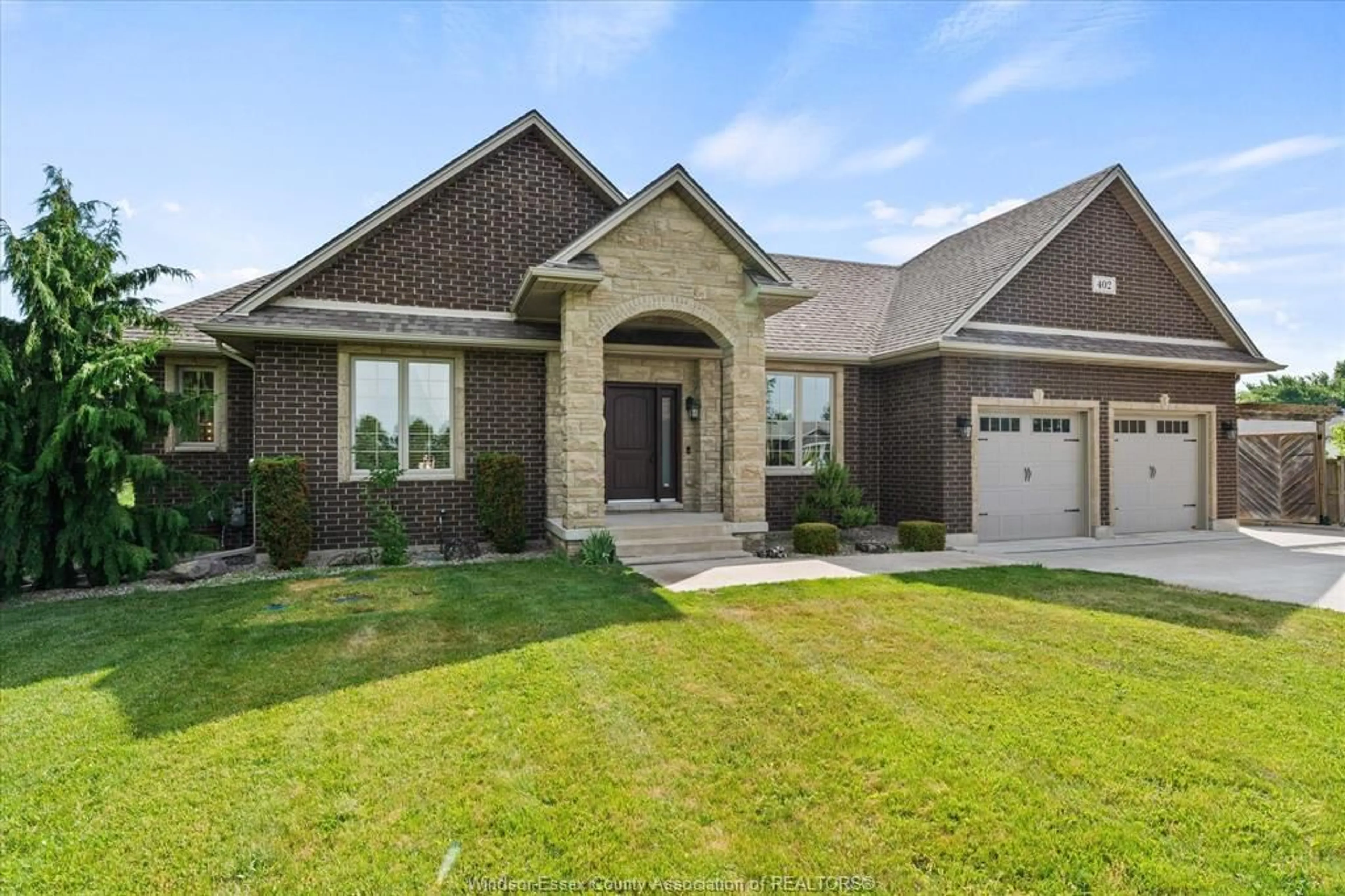 Home with brick exterior material, street for 402 COUNTY RD 34, North Ridge Ontario N8M 2X5