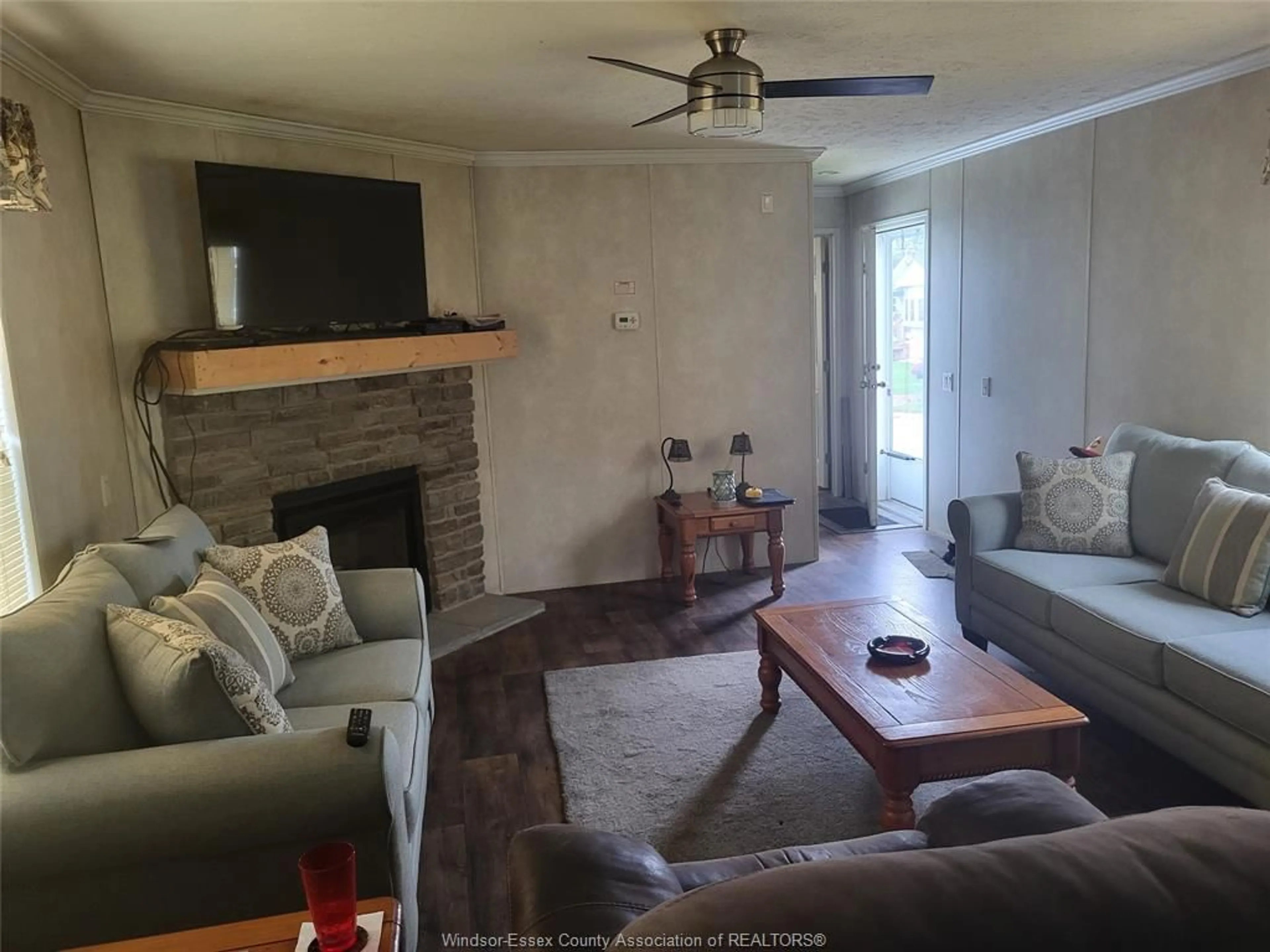 Living room with furniture, wood/laminate floor for 21 WILDER, Lakeshore Ontario N8N 2S9