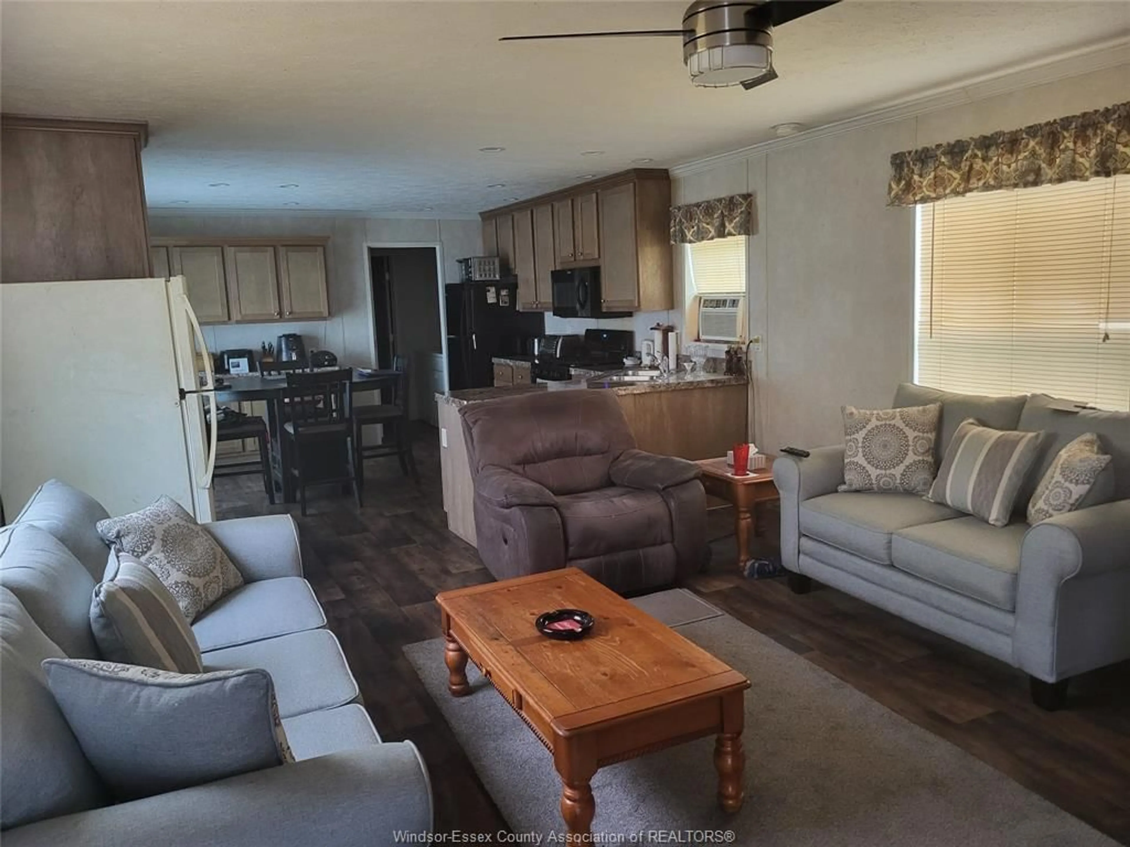 Living room with furniture, wood/laminate floor for 21 WILDER, Lakeshore Ontario N8N 2S9