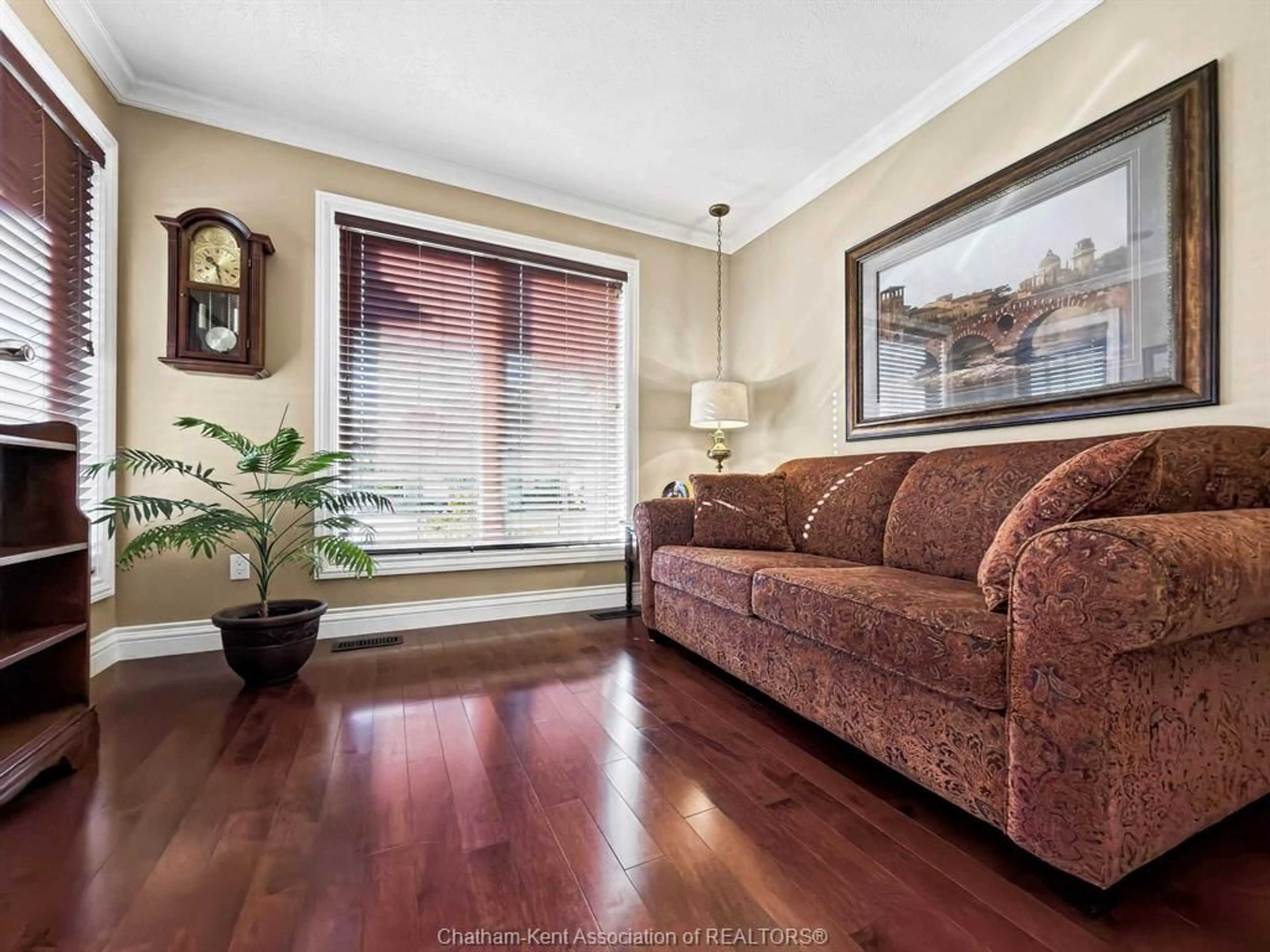 Living room with furniture, wood/laminate floor for 4 McKee Rd, Wallaceburg Ontario N8A 5G3