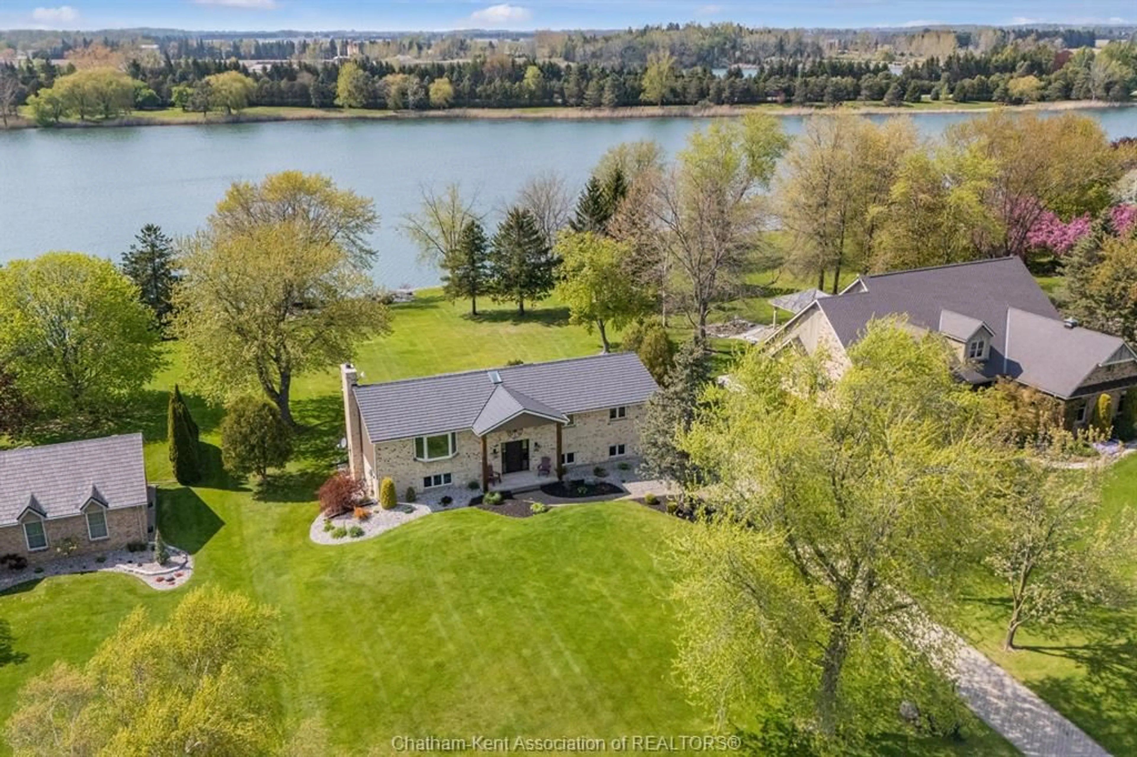 A pic from outside/outdoor area/front of a property/back of a property/a pic from drone, water/lake/river/ocean view for 10609 Lakeview Dr, Harwich Township Ontario N7M 5J3