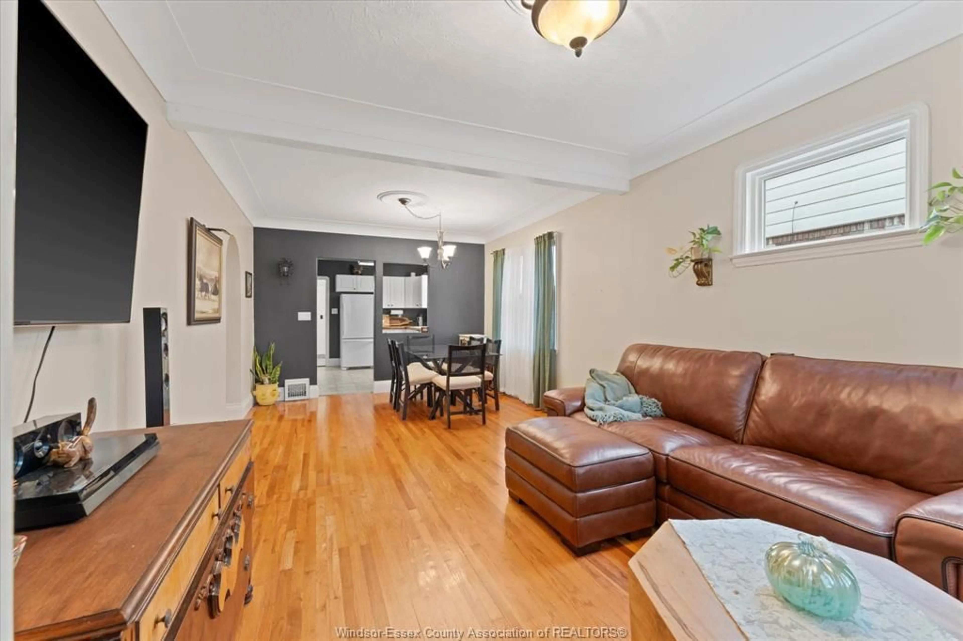 Living room with furniture, wood/laminate floor for 1746 Alexis Rd, Windsor Ontario N8Y 4P5