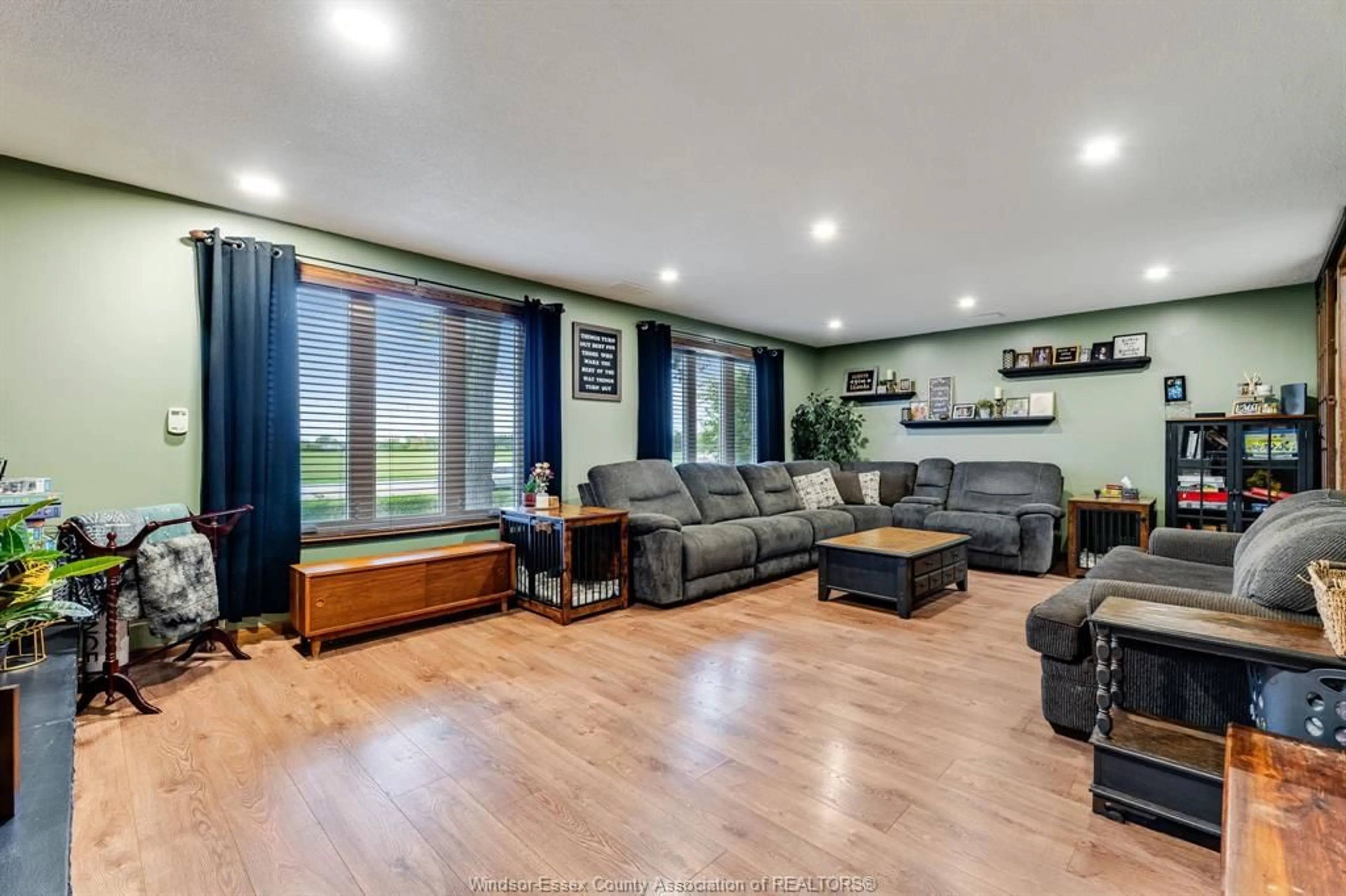 Living room with furniture, wood/laminate floor for 2477 Albuna Townline, Kingsville Ontario N9Y 2E5