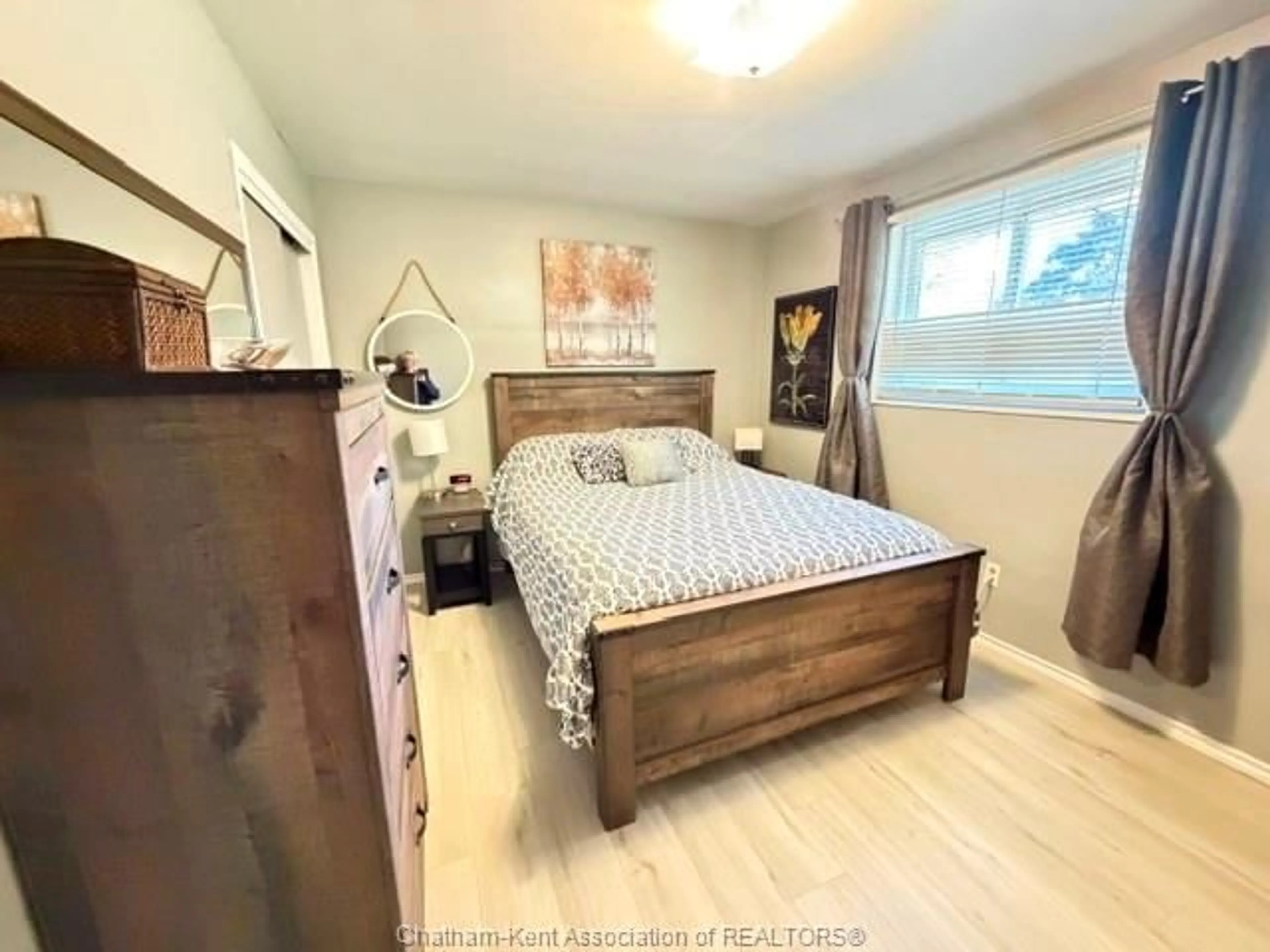 Bedroom with bed, wood/laminate floor for 35 Sudbury Dr, Chatham Ontario N7L 2K1