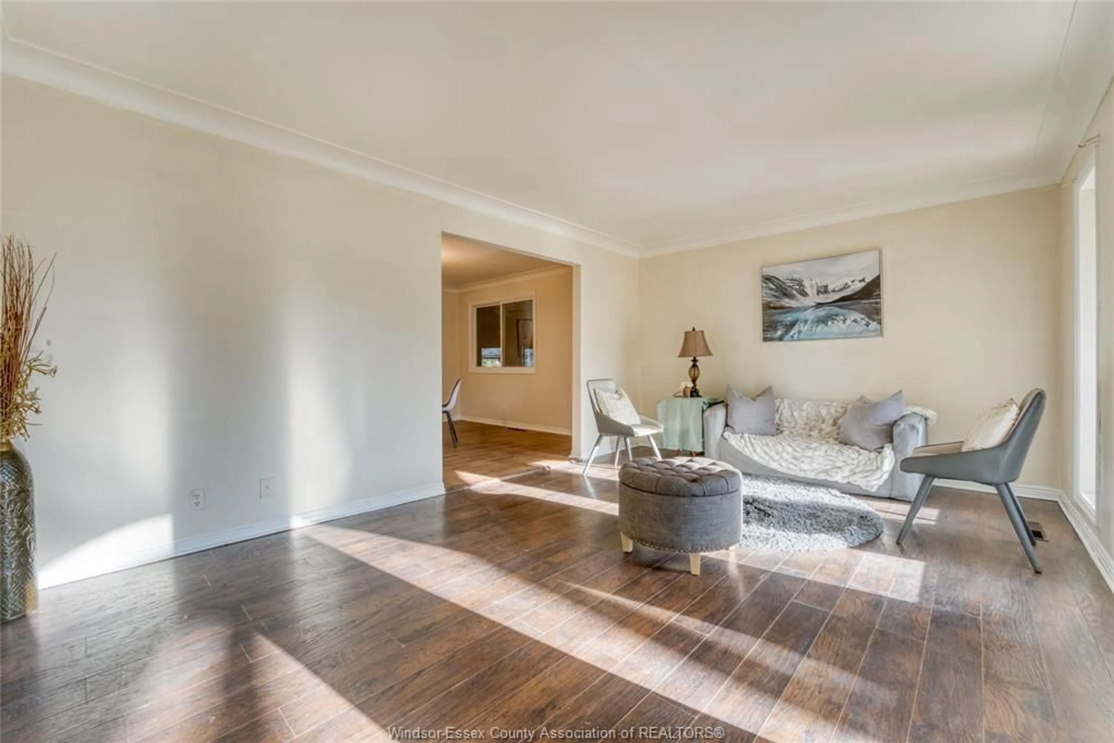 Living room with furniture, wood/laminate floor for 2880 ST. CLAIR Ave, Windsor Ontario N9E 4B4
