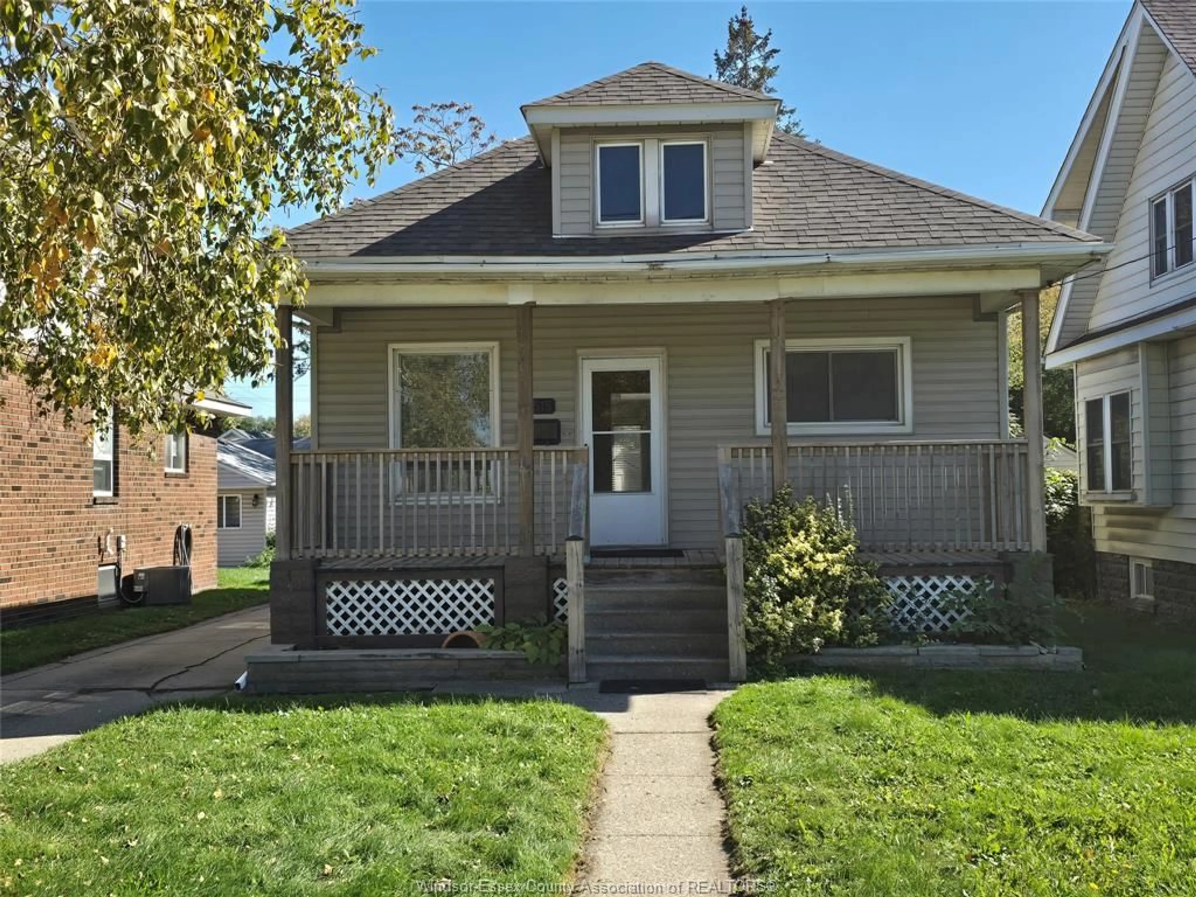 Home with vinyl exterior material, street for 3515 SANDWICH St, Windsor Ontario N9C 1B6