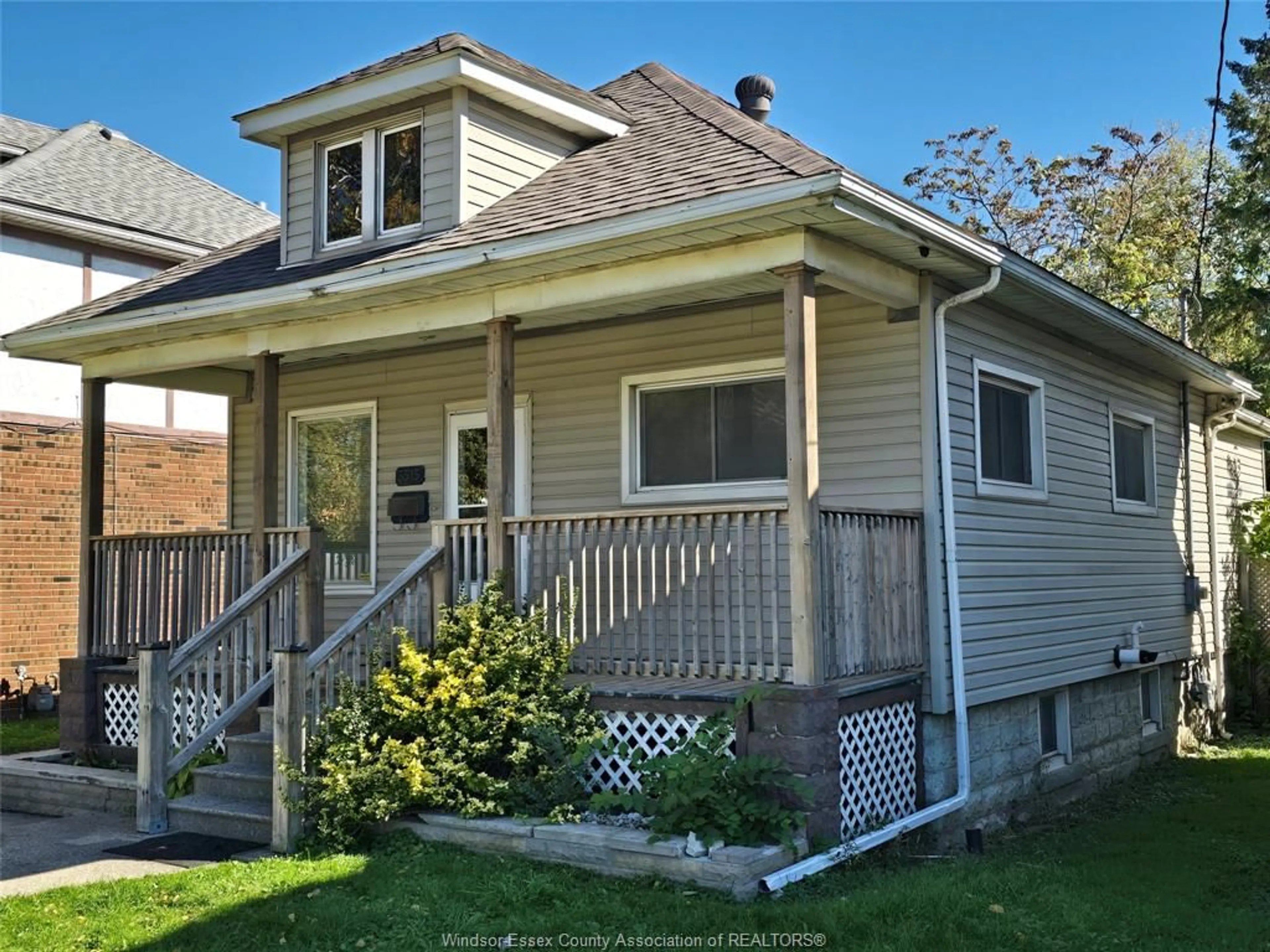 Home with vinyl exterior material, street for 3515 SANDWICH St, Windsor Ontario N9C 1B6