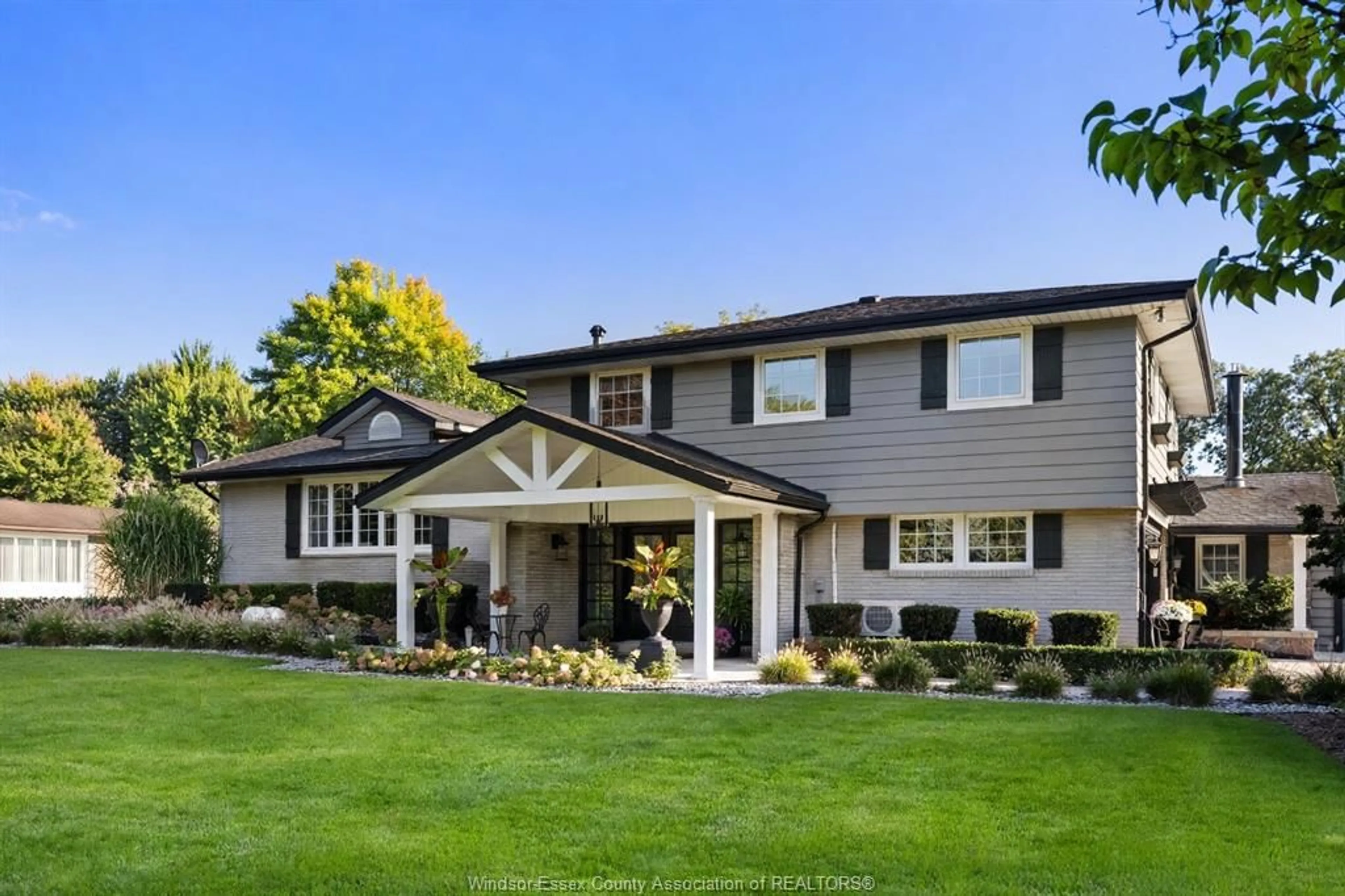 Home with vinyl exterior material, street for 375 RUSSELL WOODS Dr, Lakeshore Ontario N8N 3S6