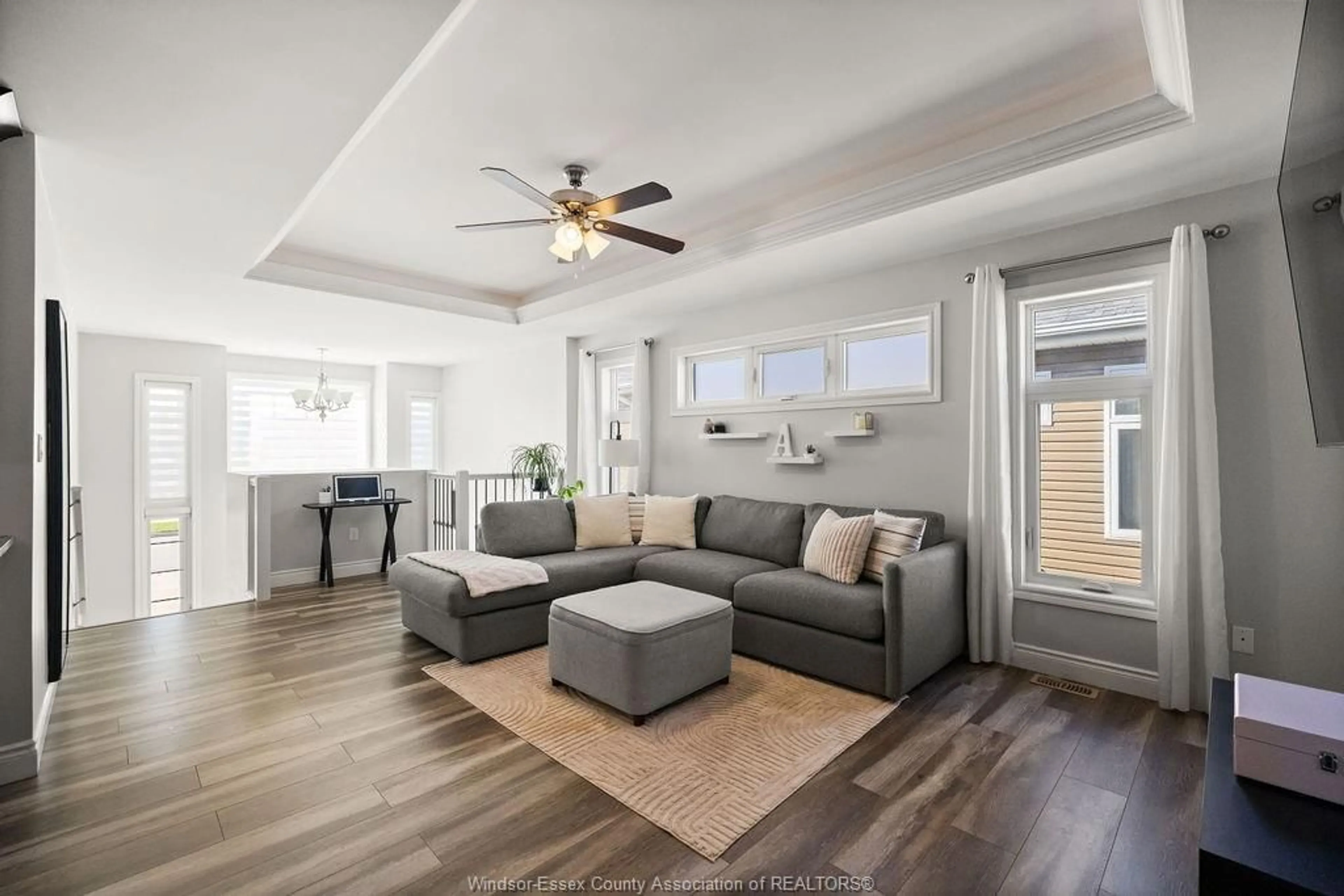 Living room with furniture, wood/laminate floor for 67 HAZEL Cres, Kingsville Ontario N9Y 3A1