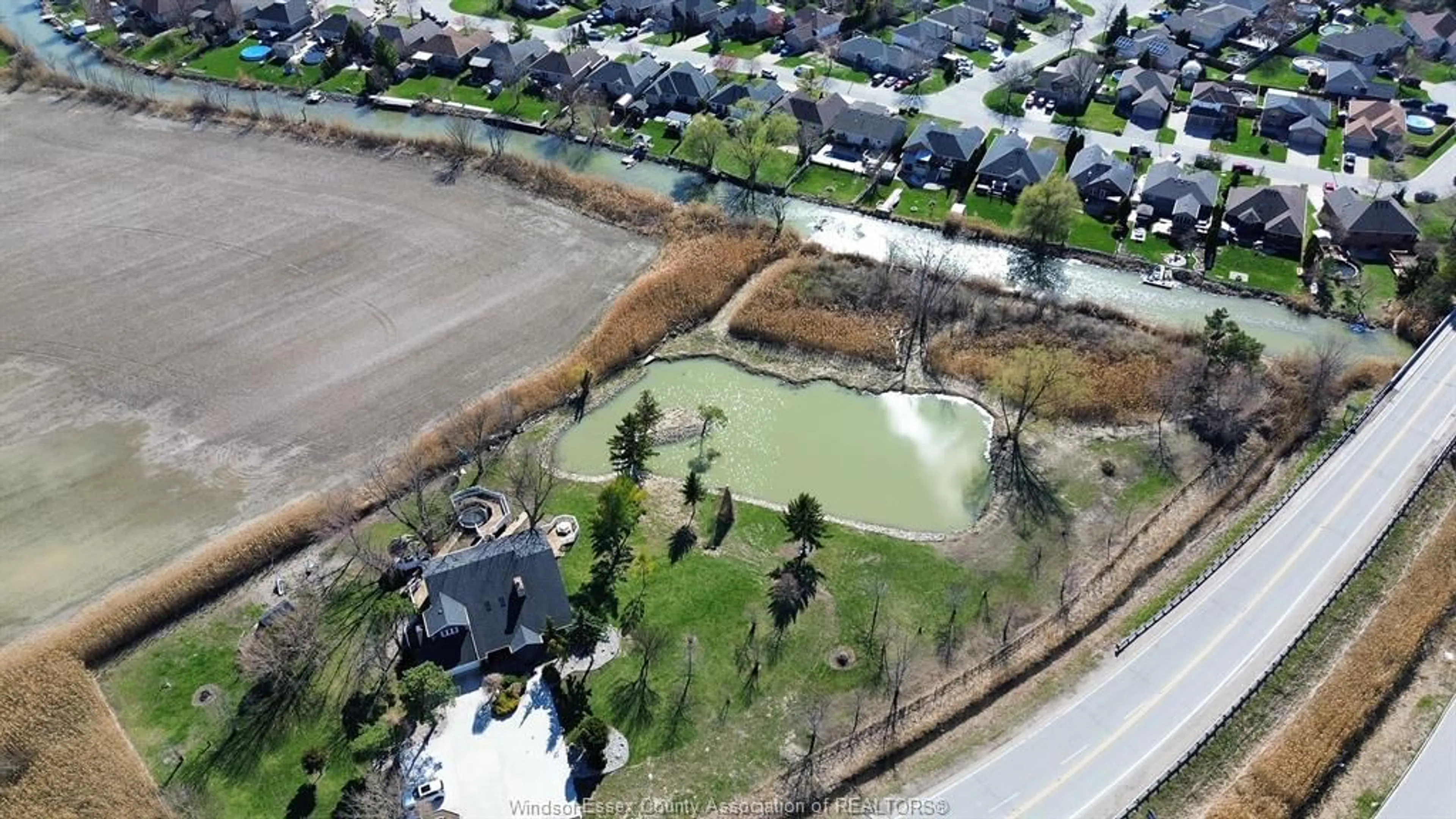 A pic from outside/outdoor area/front of a property/back of a property/a pic from drone, water/lake/river/ocean view for 112 COUNTY RD 22, Belle River Ontario N8L 1H8