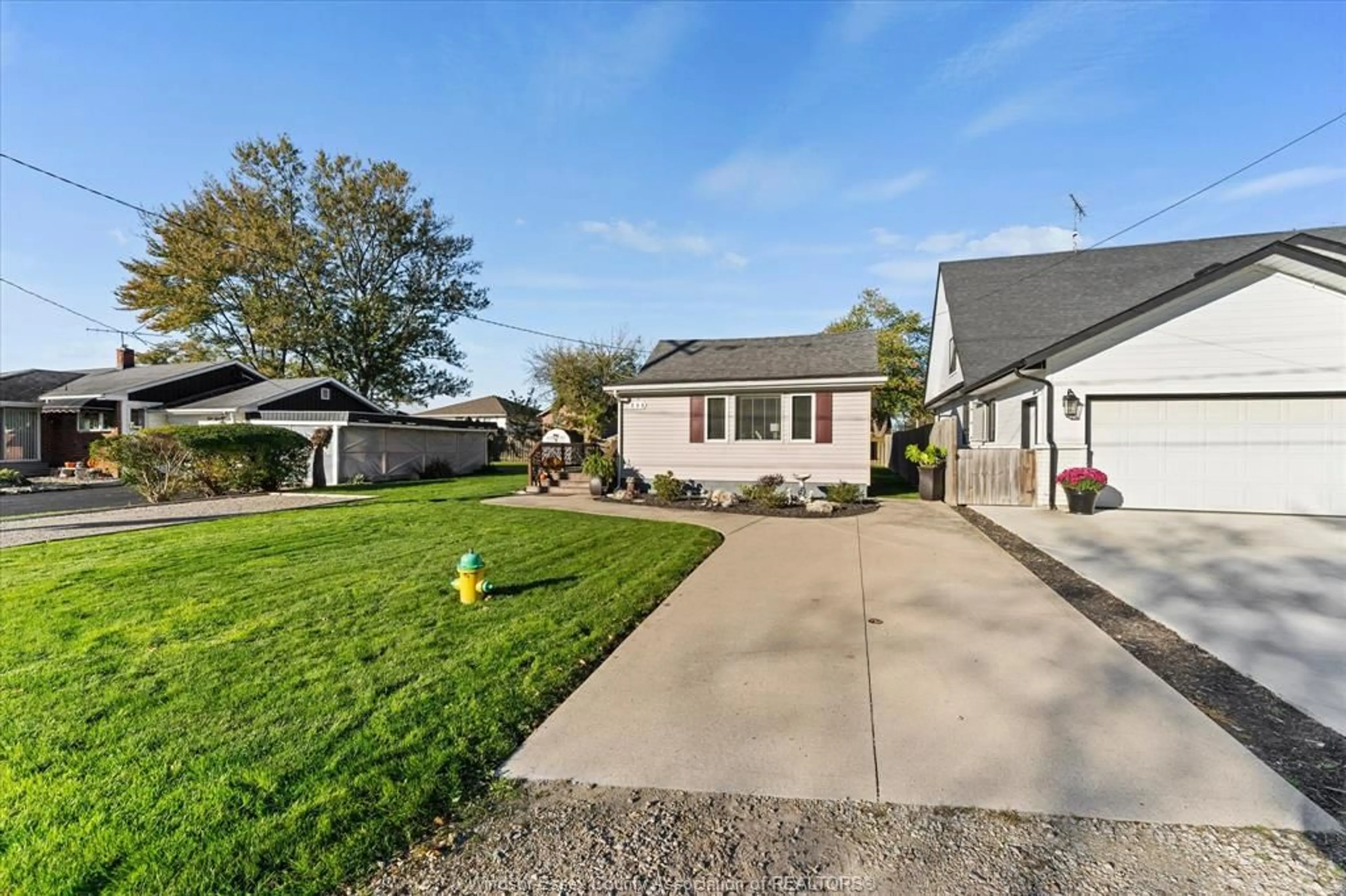 A pic from outside/outdoor area/front of a property/back of a property/a pic from drone, street for 396 WEST BELLE RIVER Rd, Lakeshore Ontario N0R 1A0