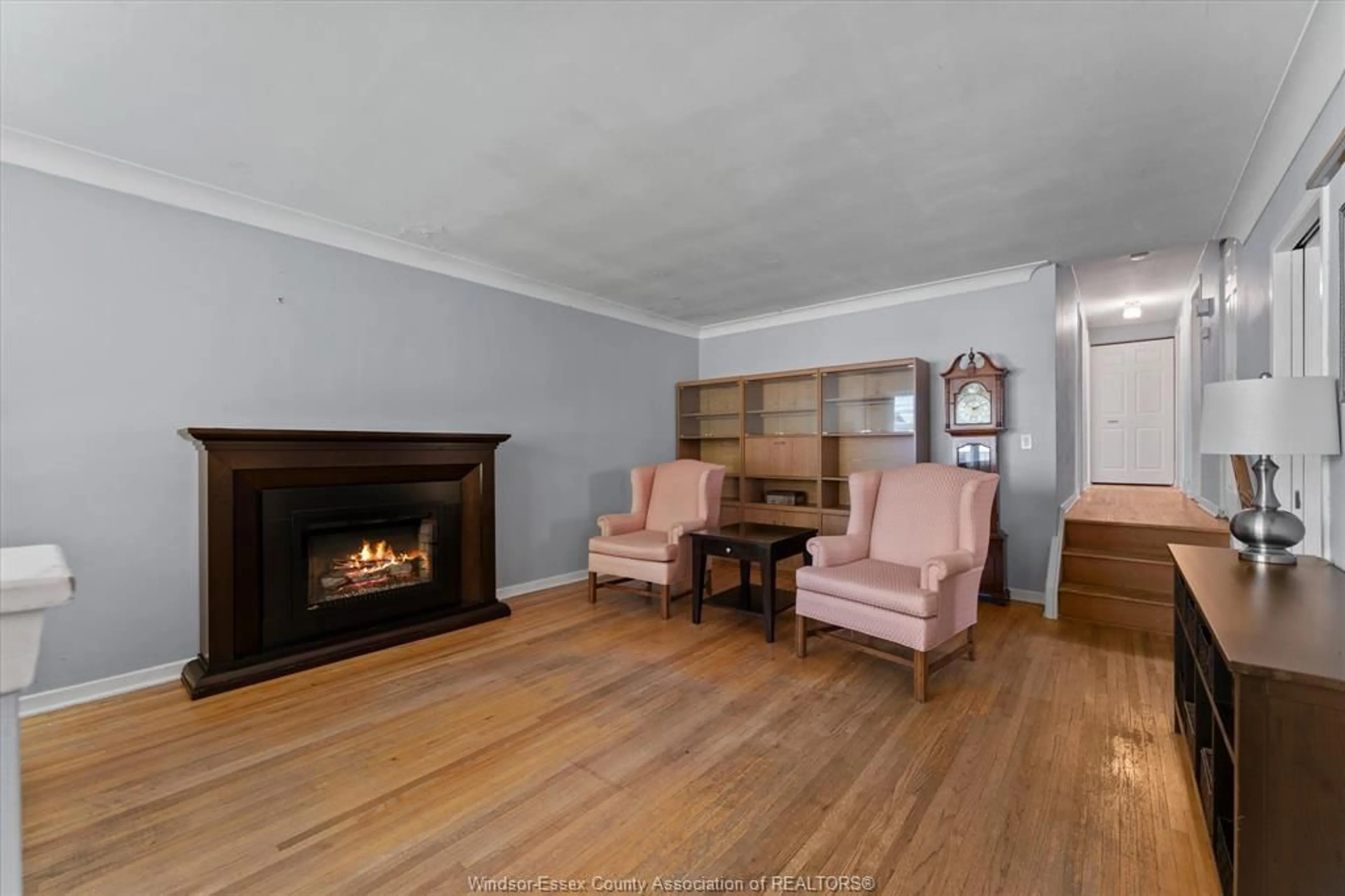 Living room with furniture, wood/laminate floor for 10205 PULBROOK, Windsor Ontario N8R 1C2