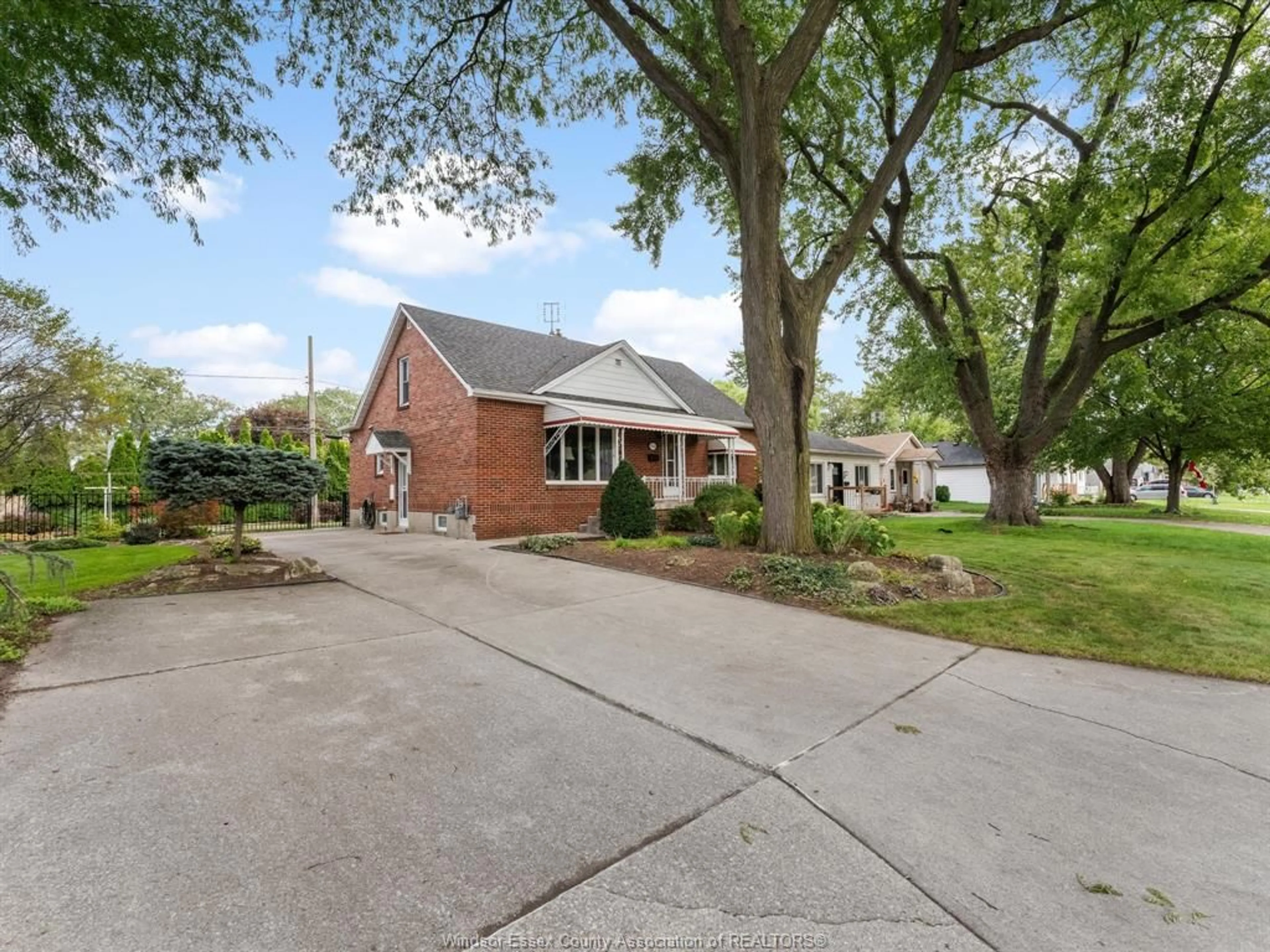 Home with brick exterior material, street for 2566 Tourangeau Rd, Windsor Ontario N8W 4N9