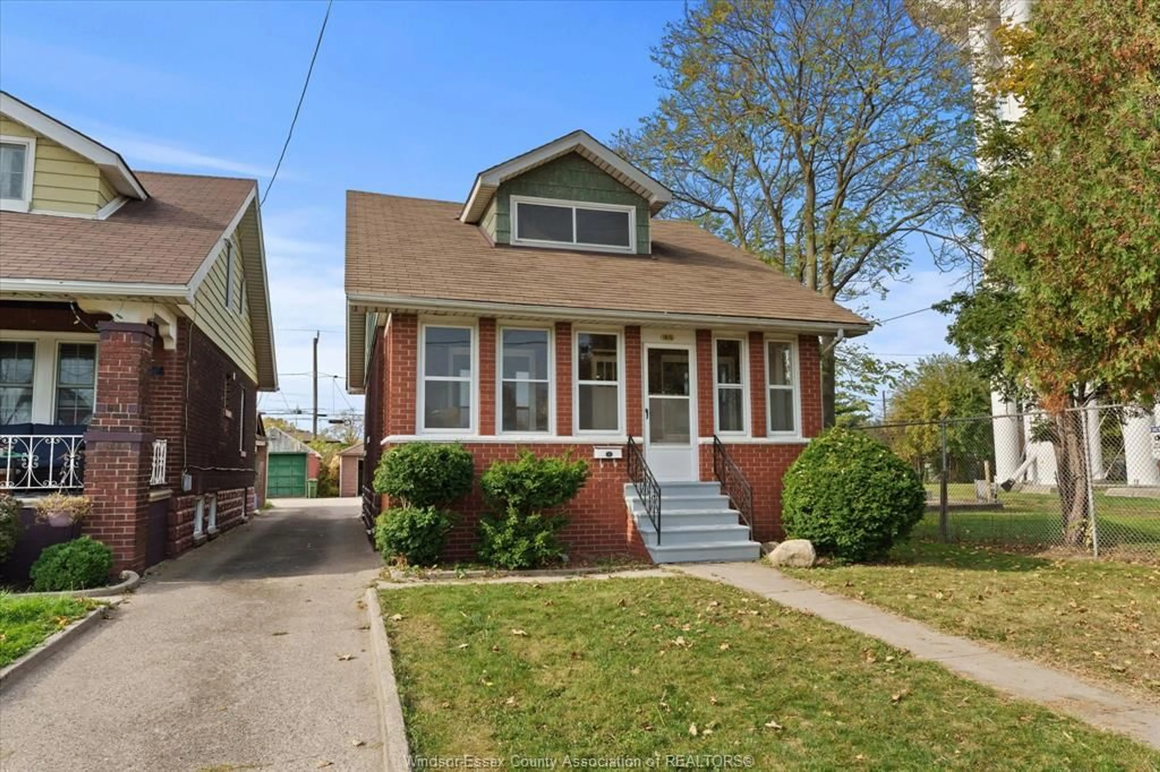 Home with brick exterior material, street for 1615 Benjamin, Windsor Ontario N8X 4N7