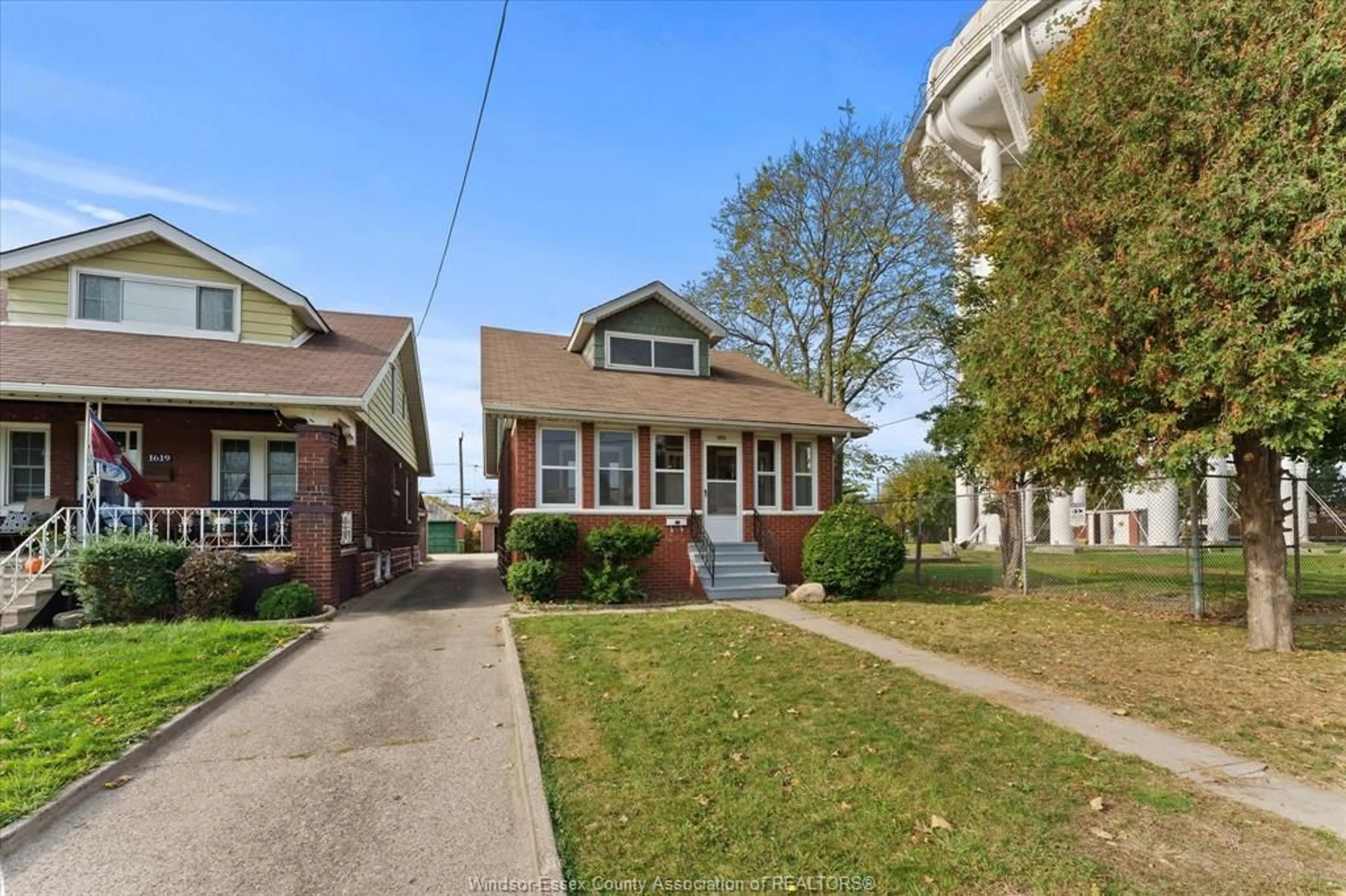 Home with brick exterior material, street for 1615 Benjamin, Windsor Ontario N8X 4N7