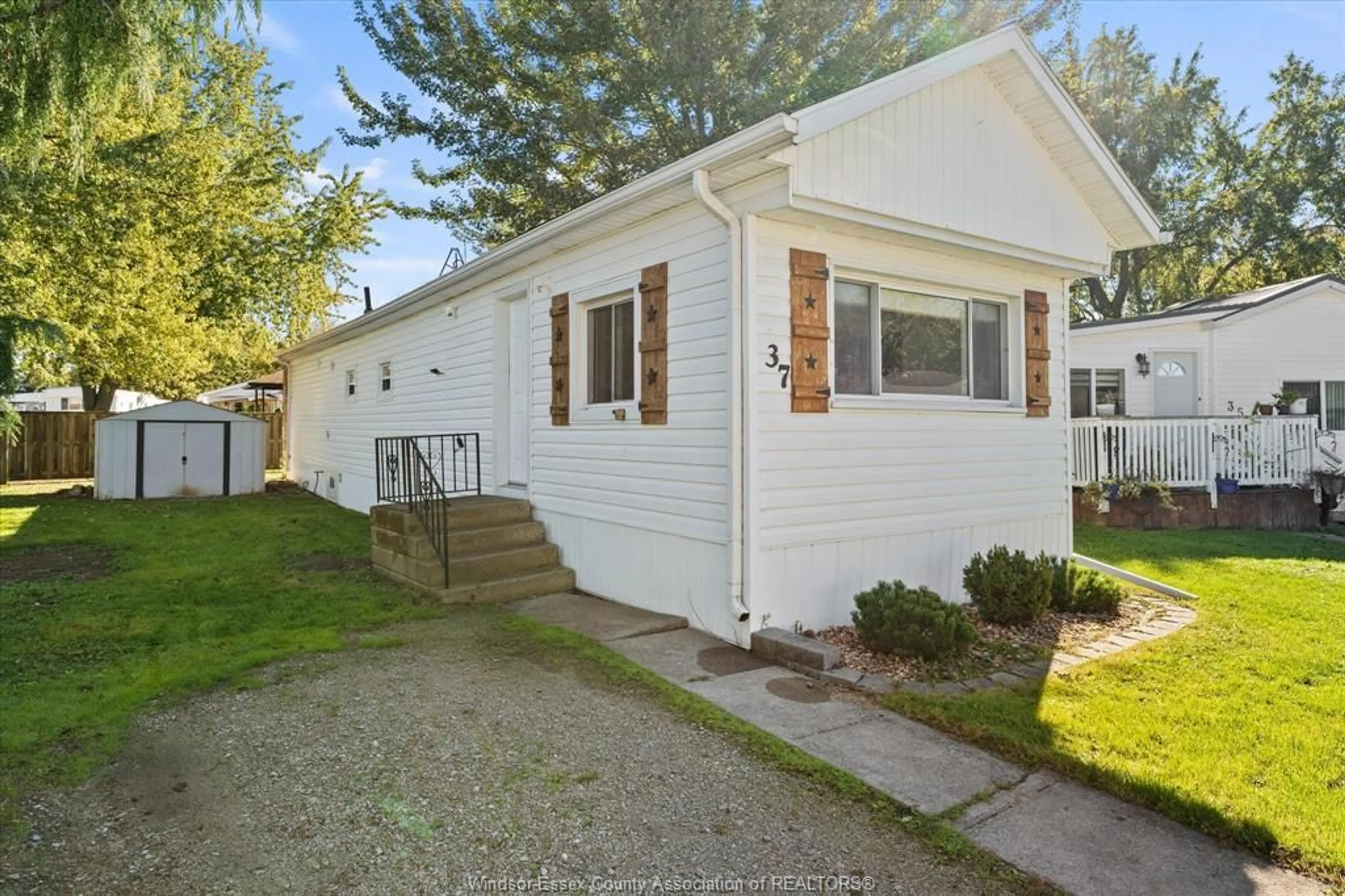 Home with vinyl exterior material, street for 37 MAPLE Dr, McGregor Ontario N0R 1J0