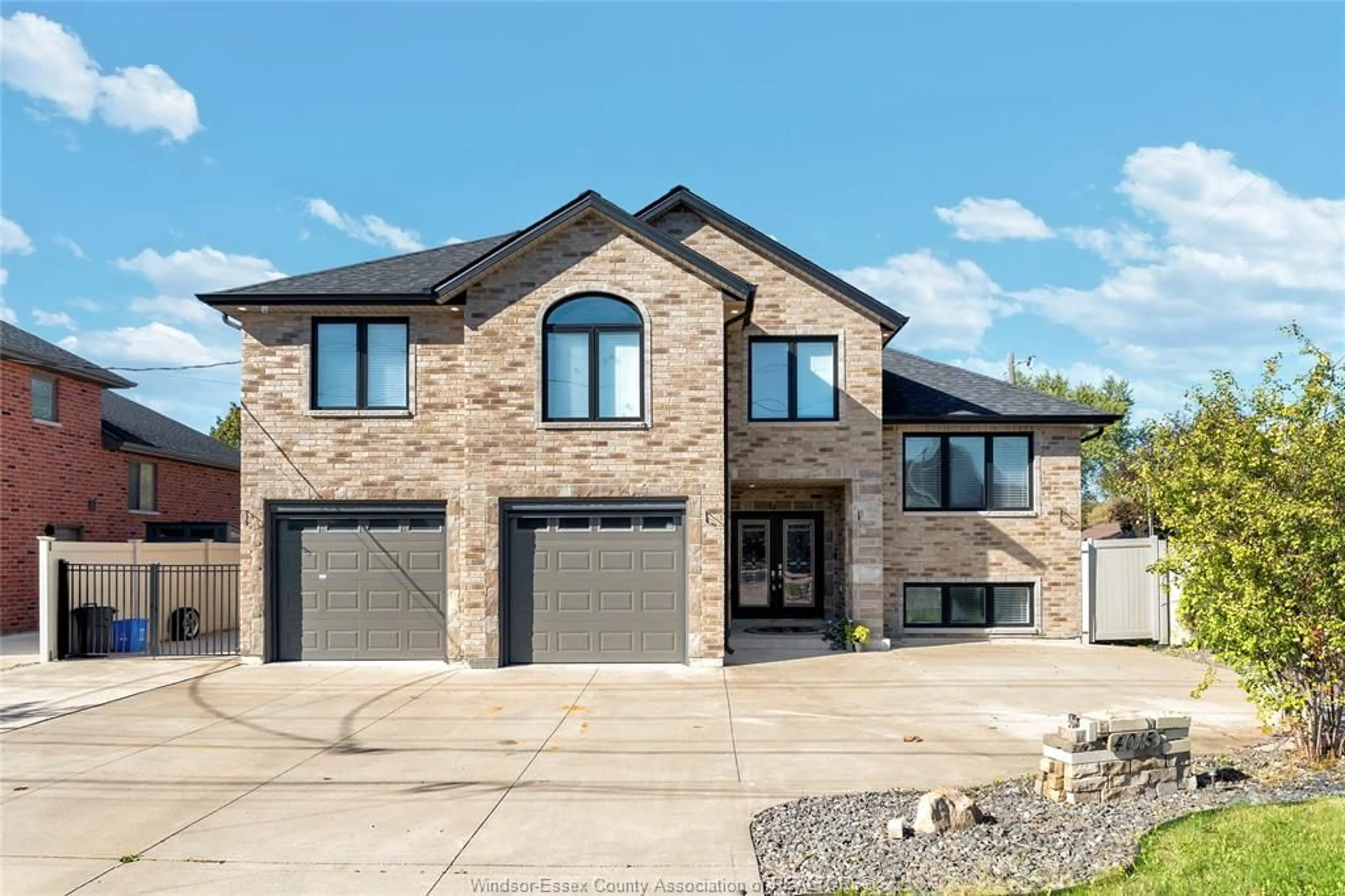 Home with brick exterior material, street for 4015 SIXTH CONCESSION, Windsor Ontario N9G 1S6