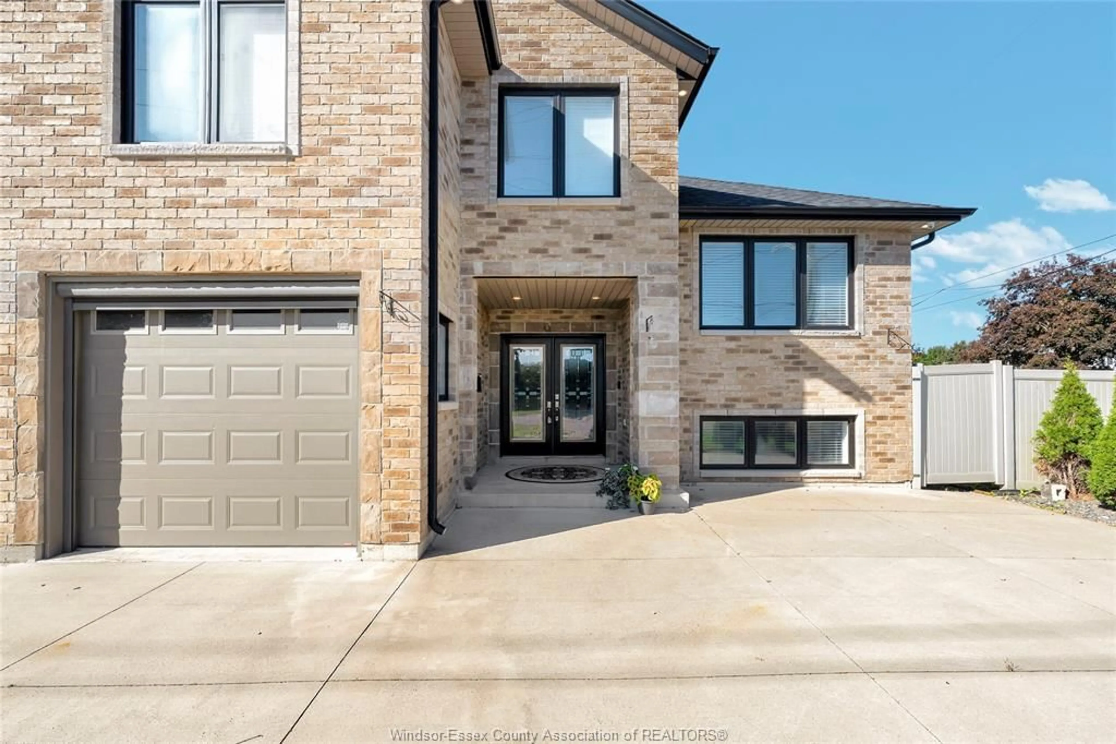 Home with brick exterior material, street for 4015 SIXTH CONCESSION, Windsor Ontario N9G 1S6