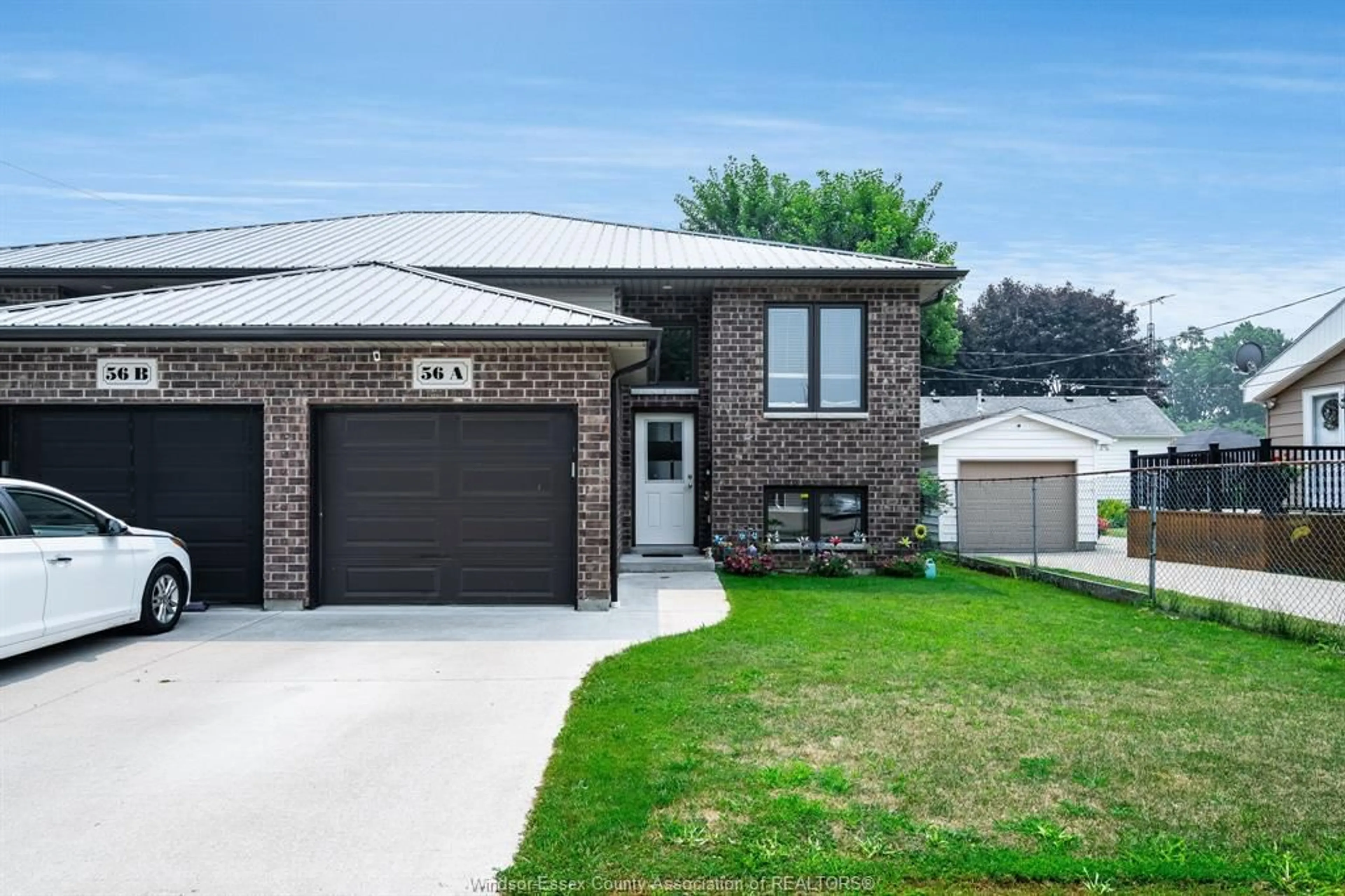 Home with brick exterior material, street for 56 Mill St #A, Leamington Ontario N8H 1S1