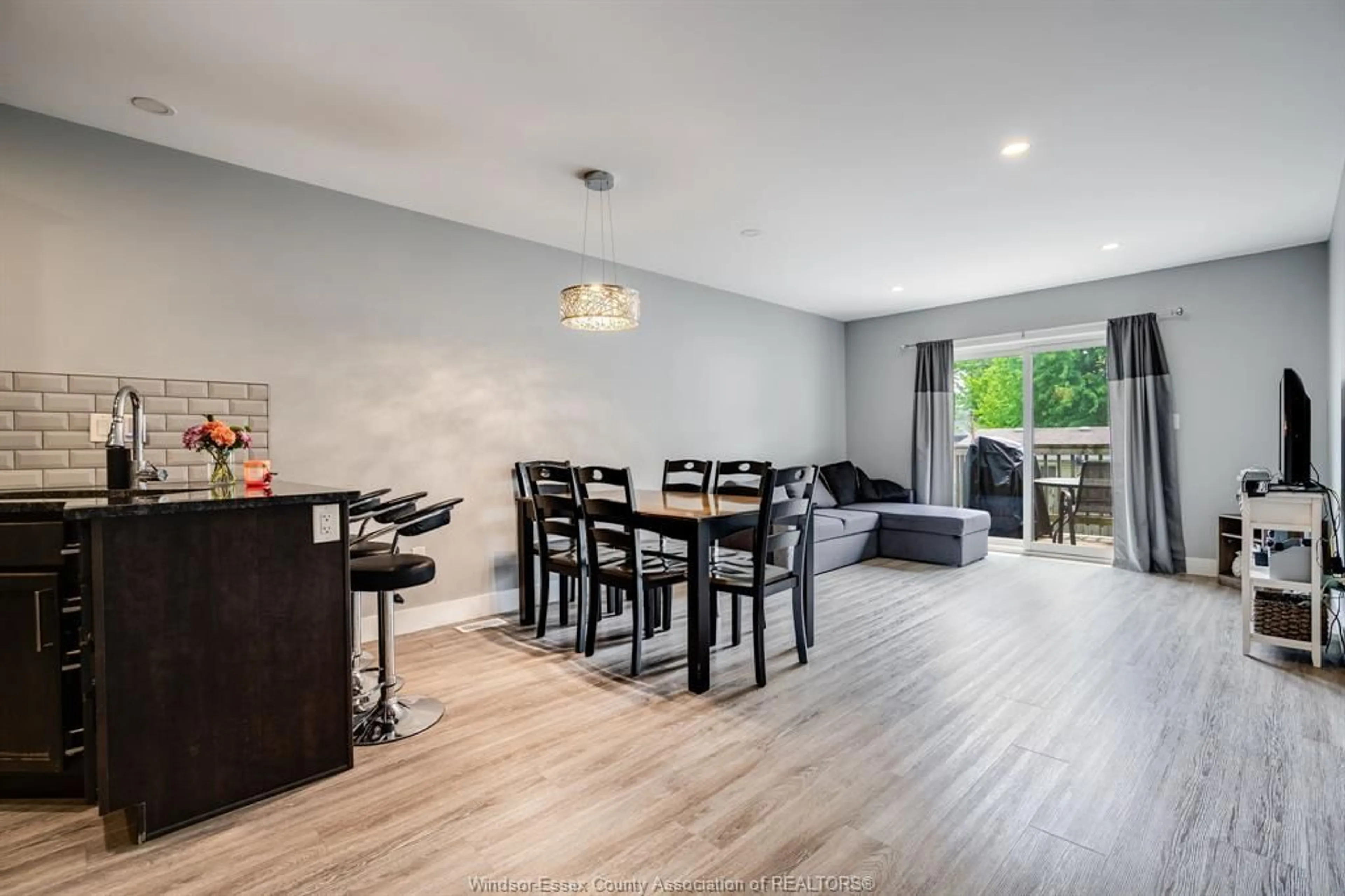 Living room with furniture, wood/laminate floor for 56 Mill St #A, Leamington Ontario N8H 1S1
