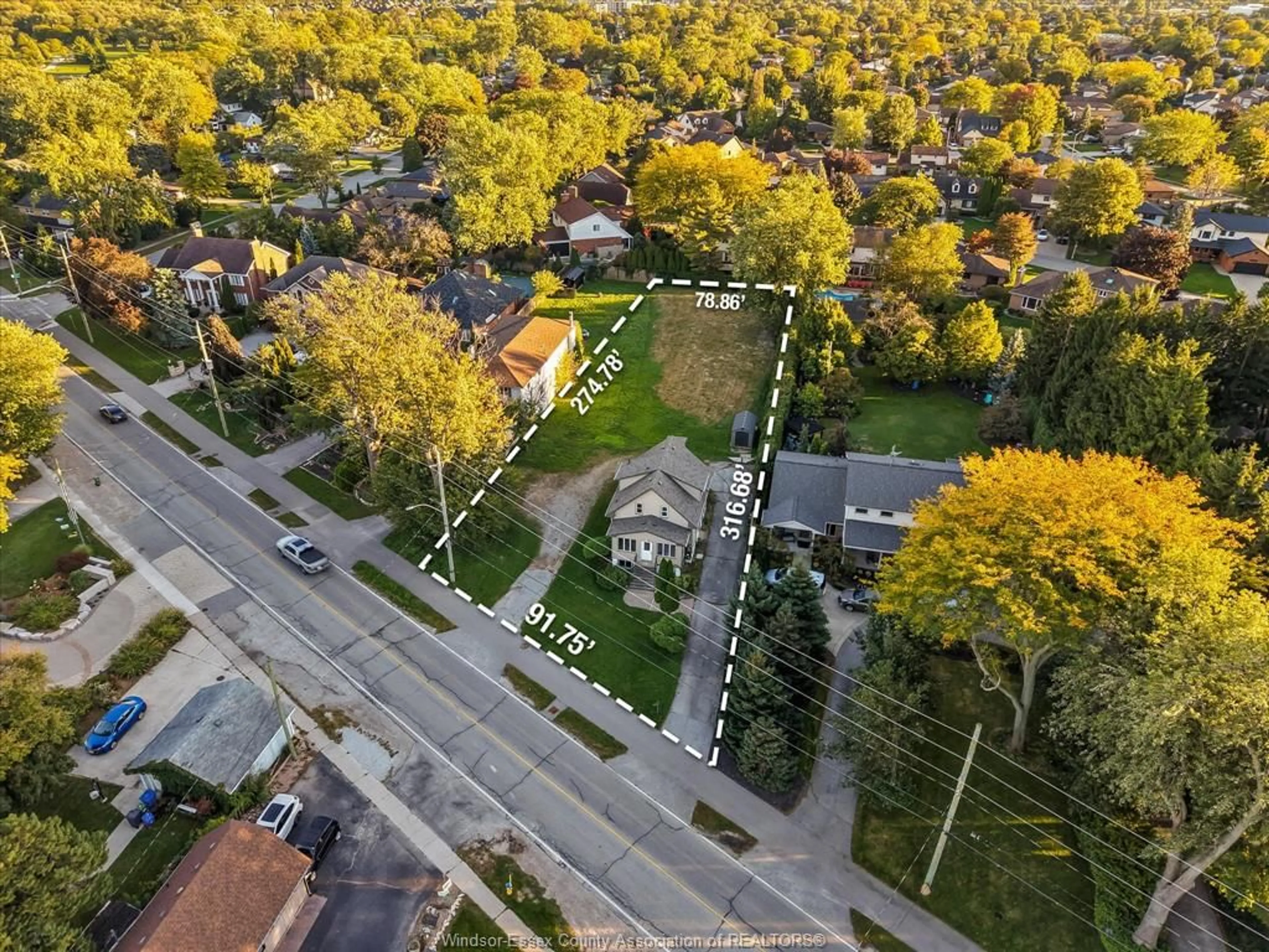 A pic from outside/outdoor area/front of a property/back of a property/a pic from drone, street for 13231/33 Riverside Dr, Tecumseh Ontario N8N 2M7