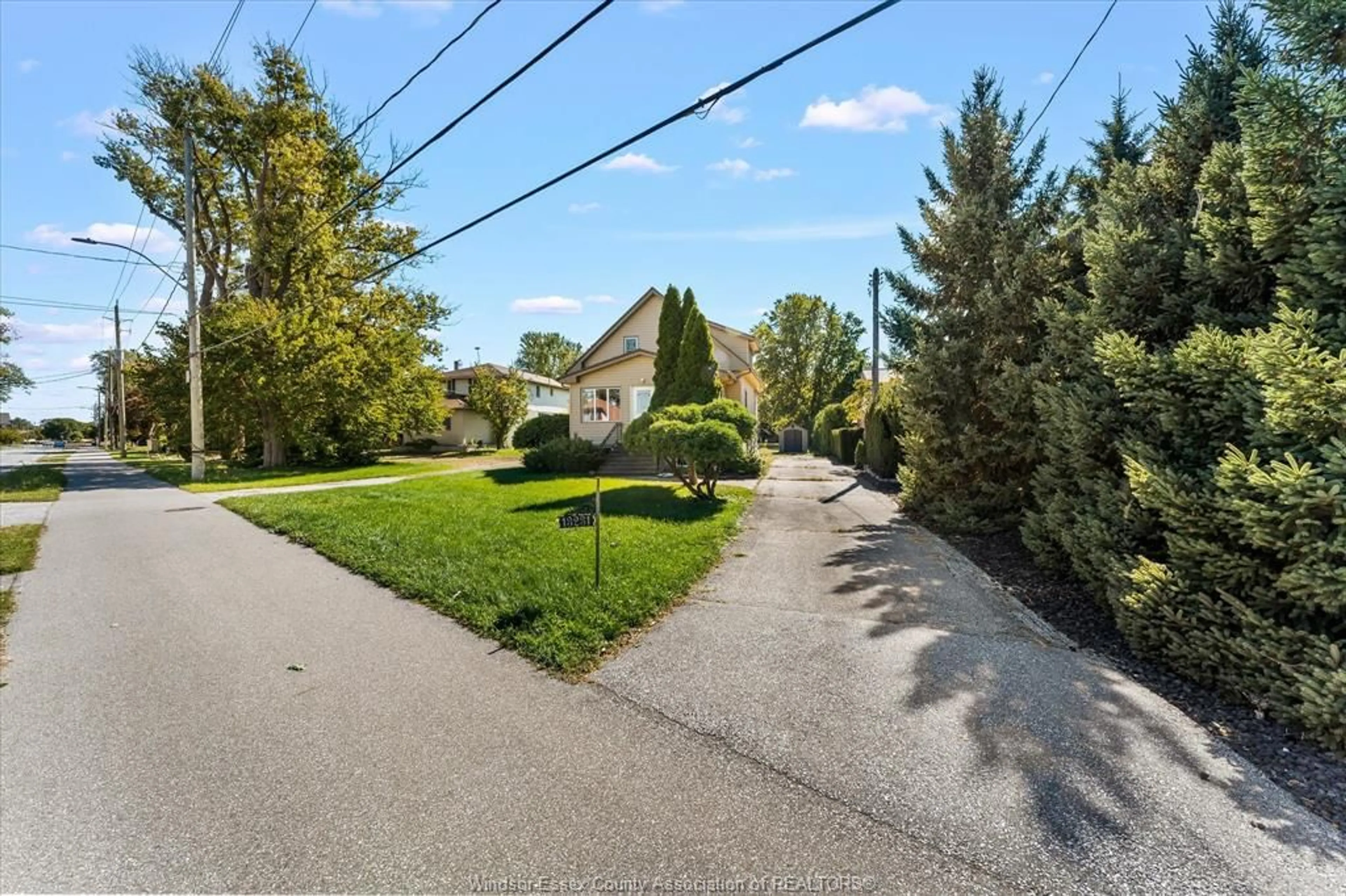 A pic from outside/outdoor area/front of a property/back of a property/a pic from drone, street for 13231/33 Riverside Dr, Tecumseh Ontario N8N 2M7
