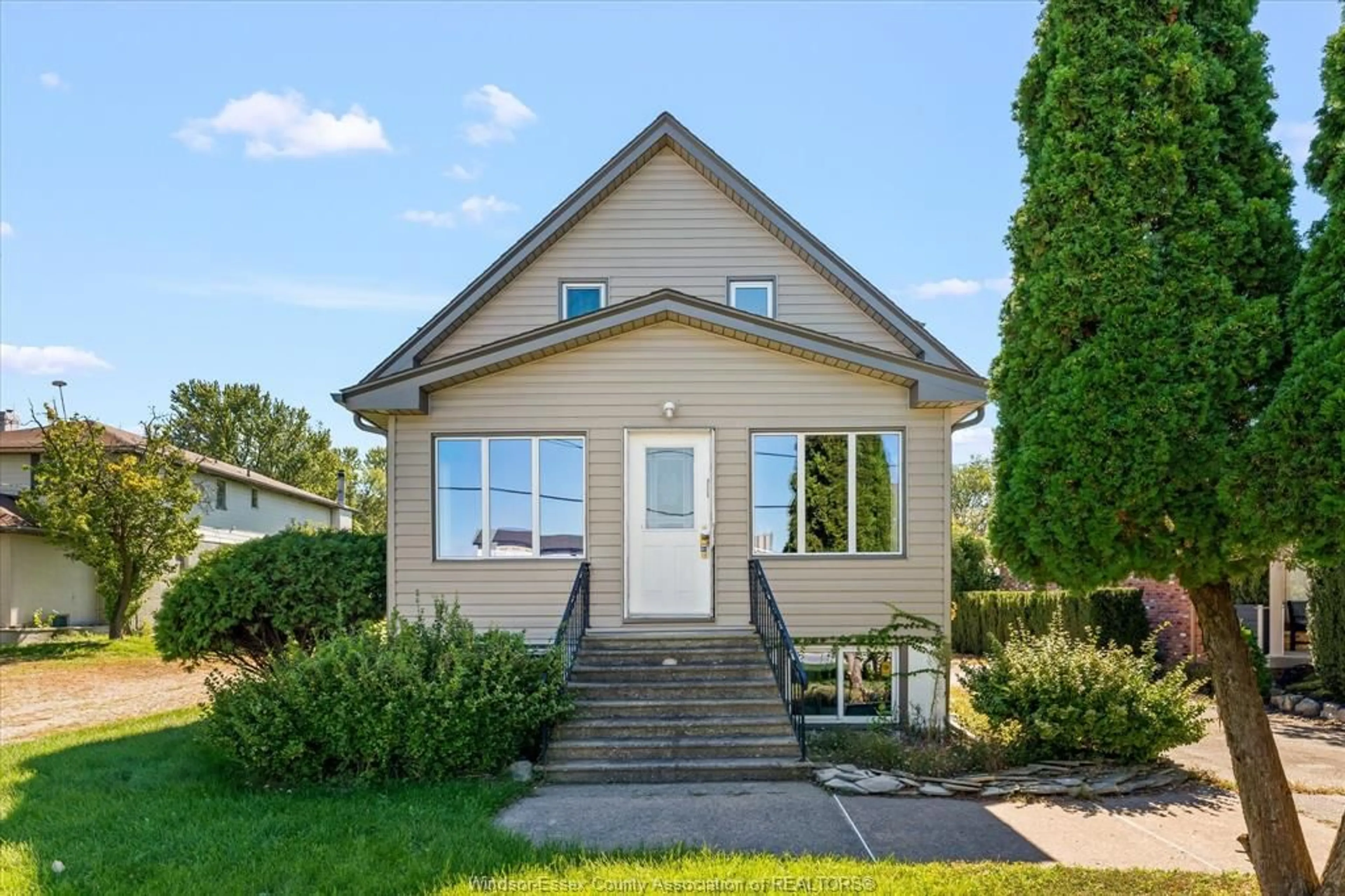 Home with vinyl exterior material, street for 13231/33 Riverside Dr, Tecumseh Ontario N8N 2M7