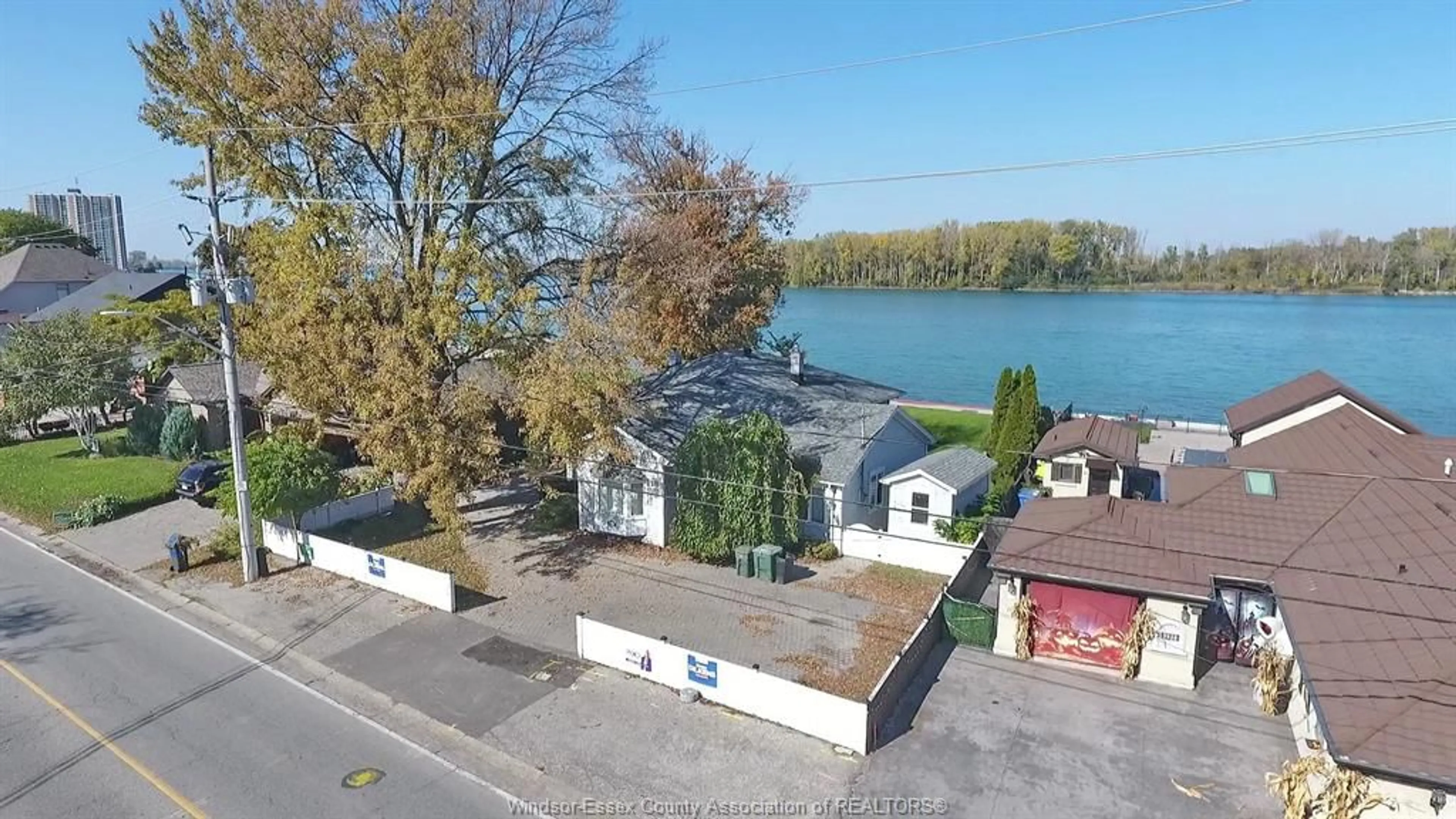 A pic from outside/outdoor area/front of a property/back of a property/a pic from drone, water/lake/river/ocean view for 9906 RIVERSIDE Dr, Windsor Ontario N8P 1A1