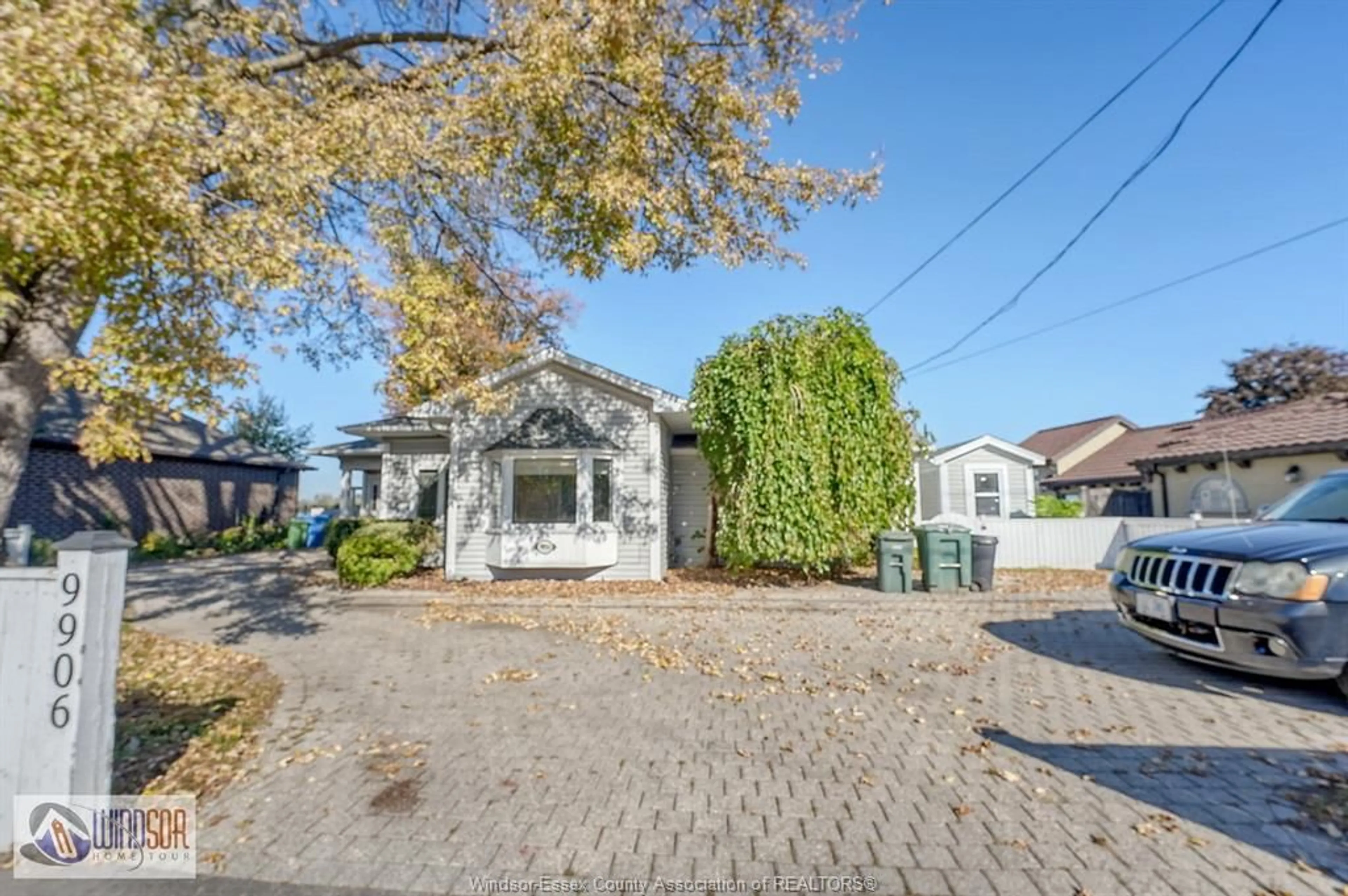A pic from outside/outdoor area/front of a property/back of a property/a pic from drone, street for 9906 RIVERSIDE Dr, Windsor Ontario N8P 1A1