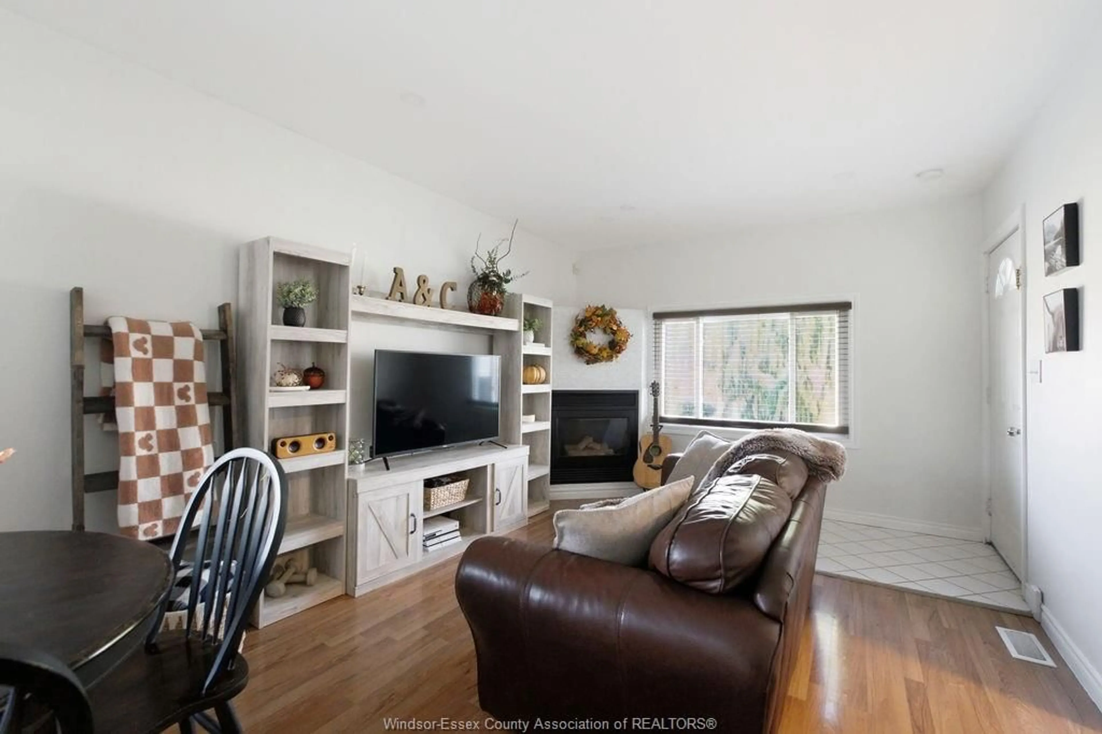 Living room with furniture, wood/laminate floor for 1903 BUCKINGHAM Dr, Windsor Ontario N8T 2A9