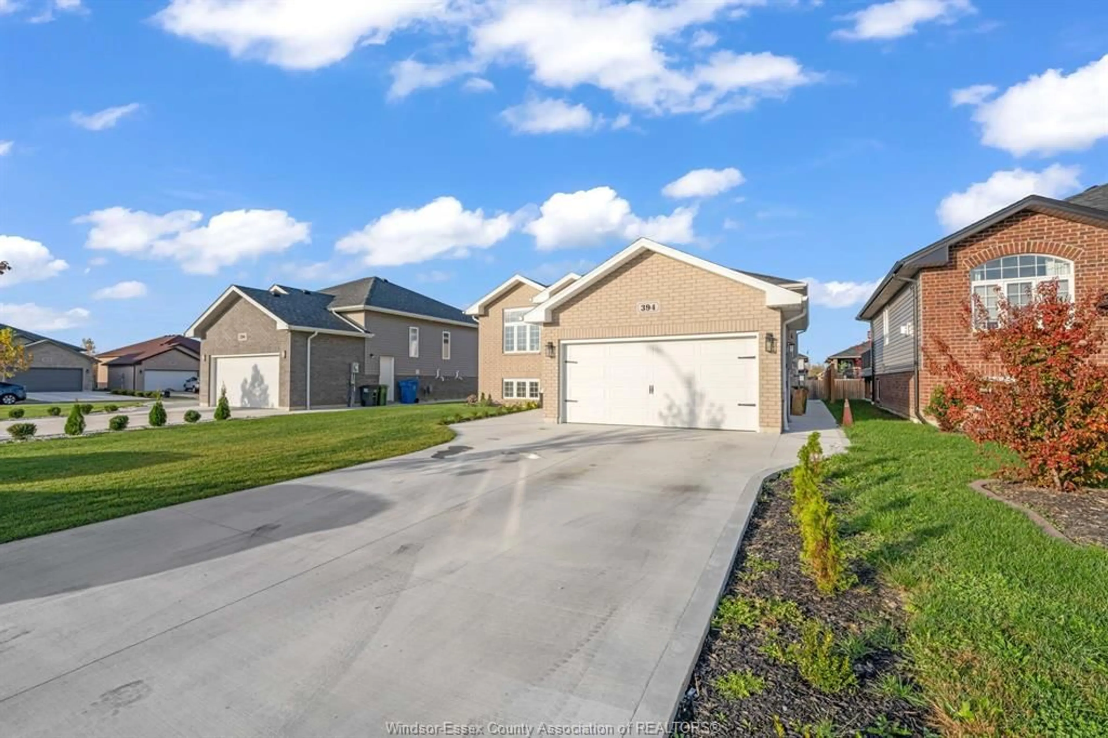 A pic from outside/outdoor area/front of a property/back of a property/a pic from drone, street for 394 Cypress Lane, Lakeshore Ontario N8L 1A8