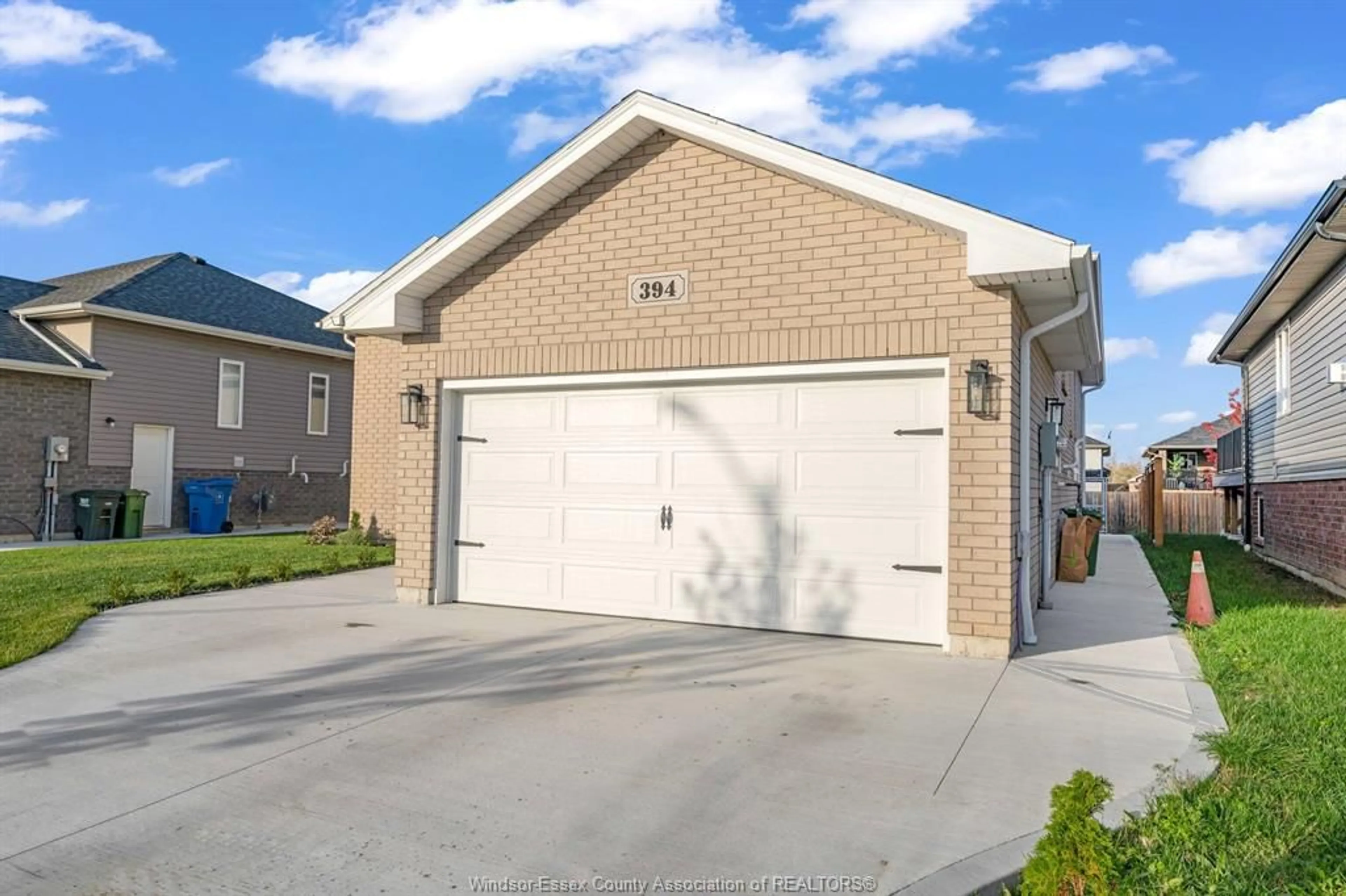 Home with brick exterior material, street for 394 Cypress Lane, Lakeshore Ontario N8L 1A8