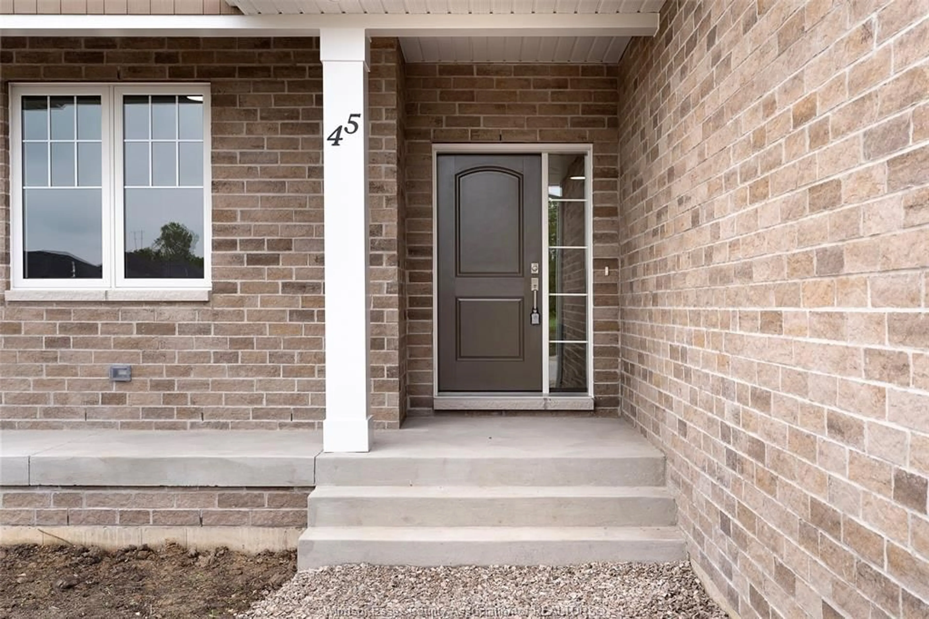Home with brick exterior material, street for 101 WESTLAWN Dr, Essex Ontario N8M 1J1