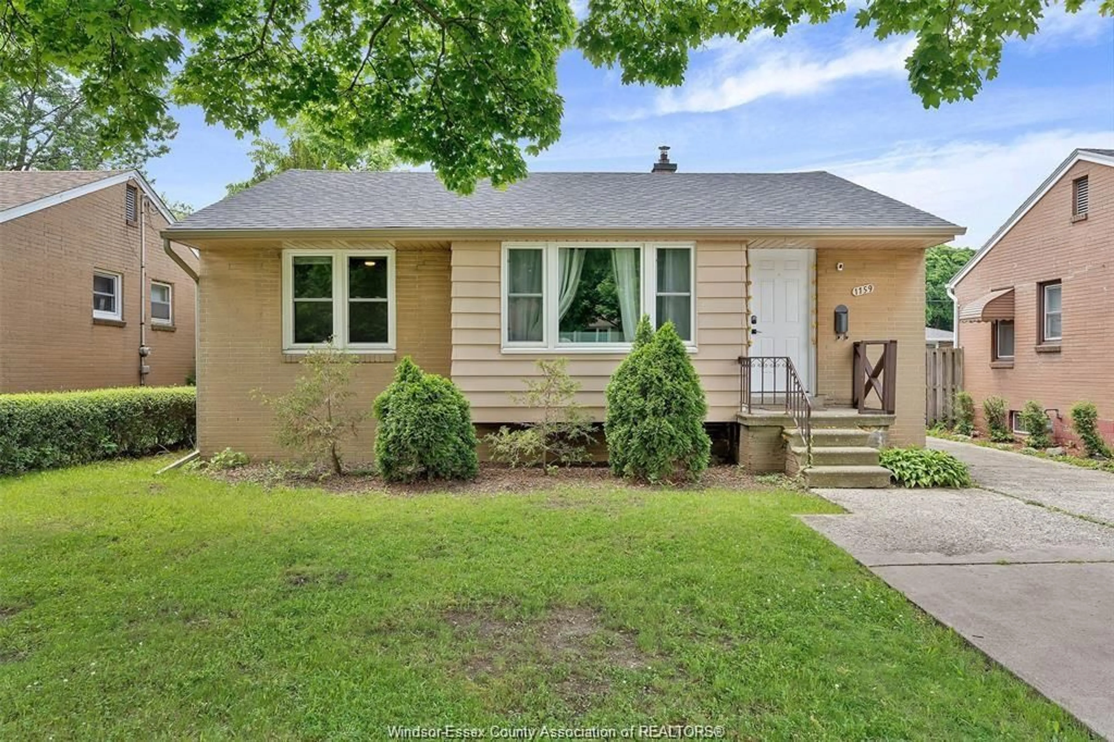 Home with vinyl exterior material, street for 1159 DOT Ave, Windsor Ontario N9C 3H9