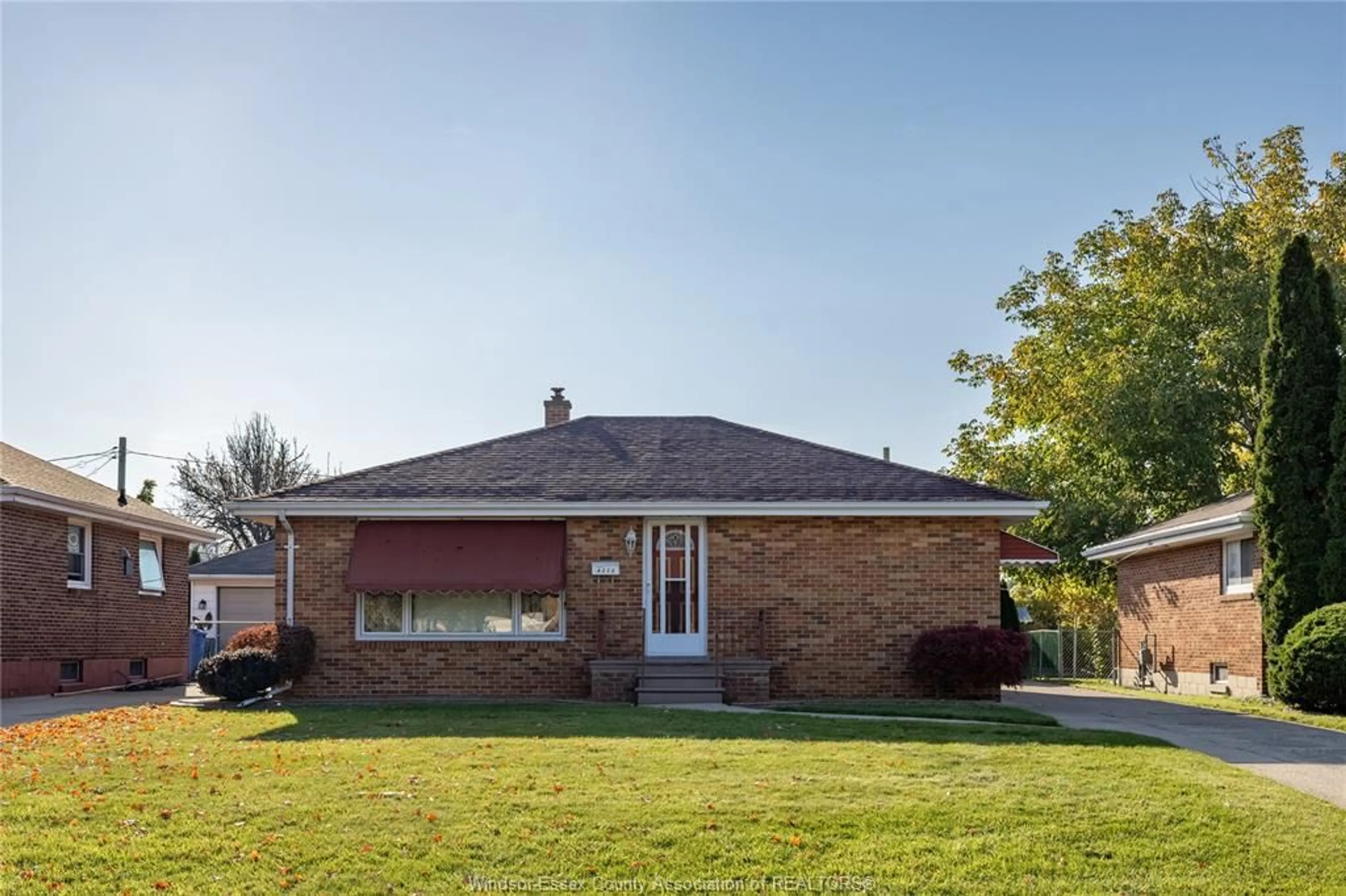 Home with brick exterior material, street for 8273 Menard, Windsor Ontario N8S 1W2
