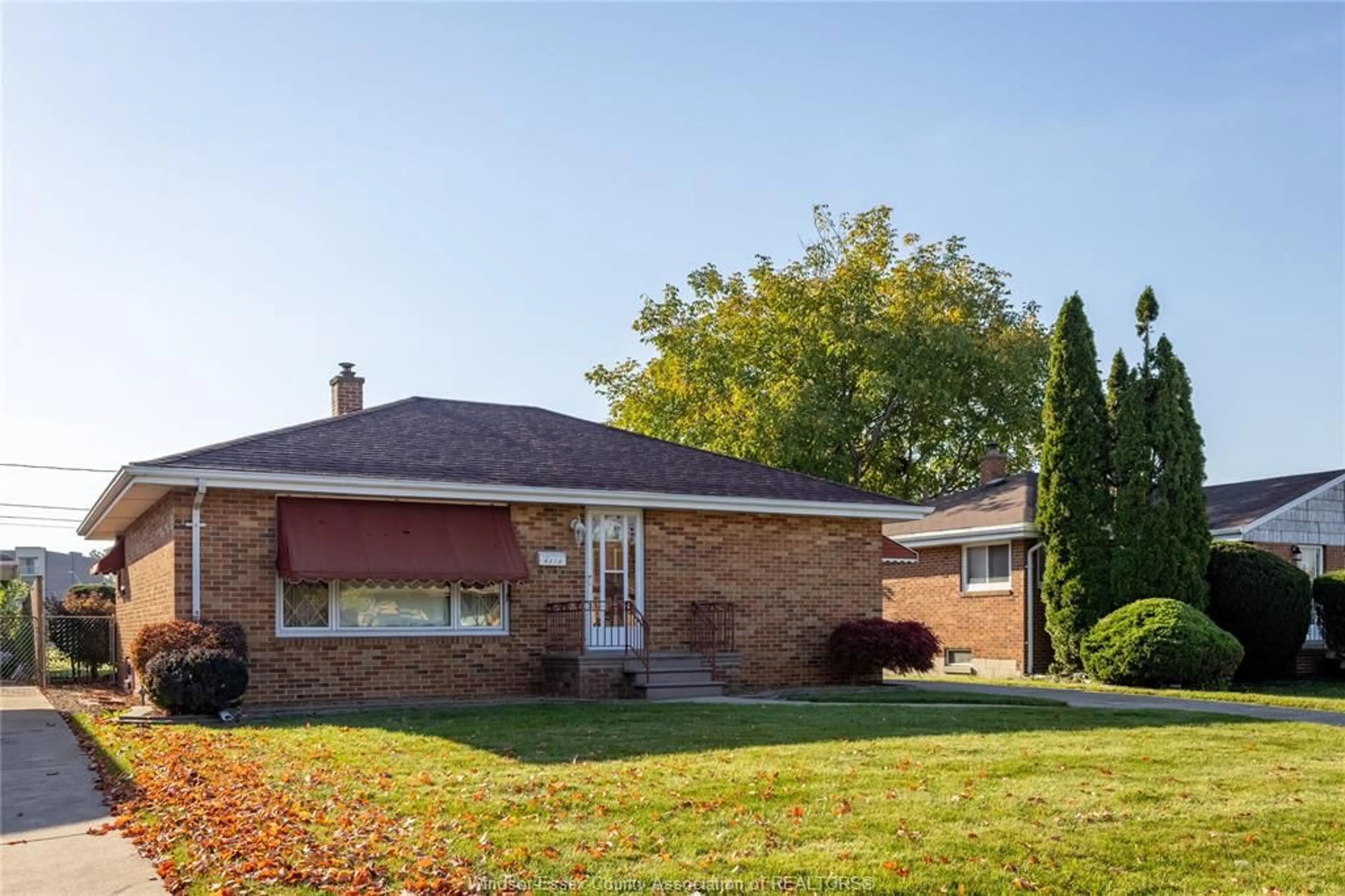 Home with brick exterior material, street for 8273 Menard, Windsor Ontario N8S 1W2