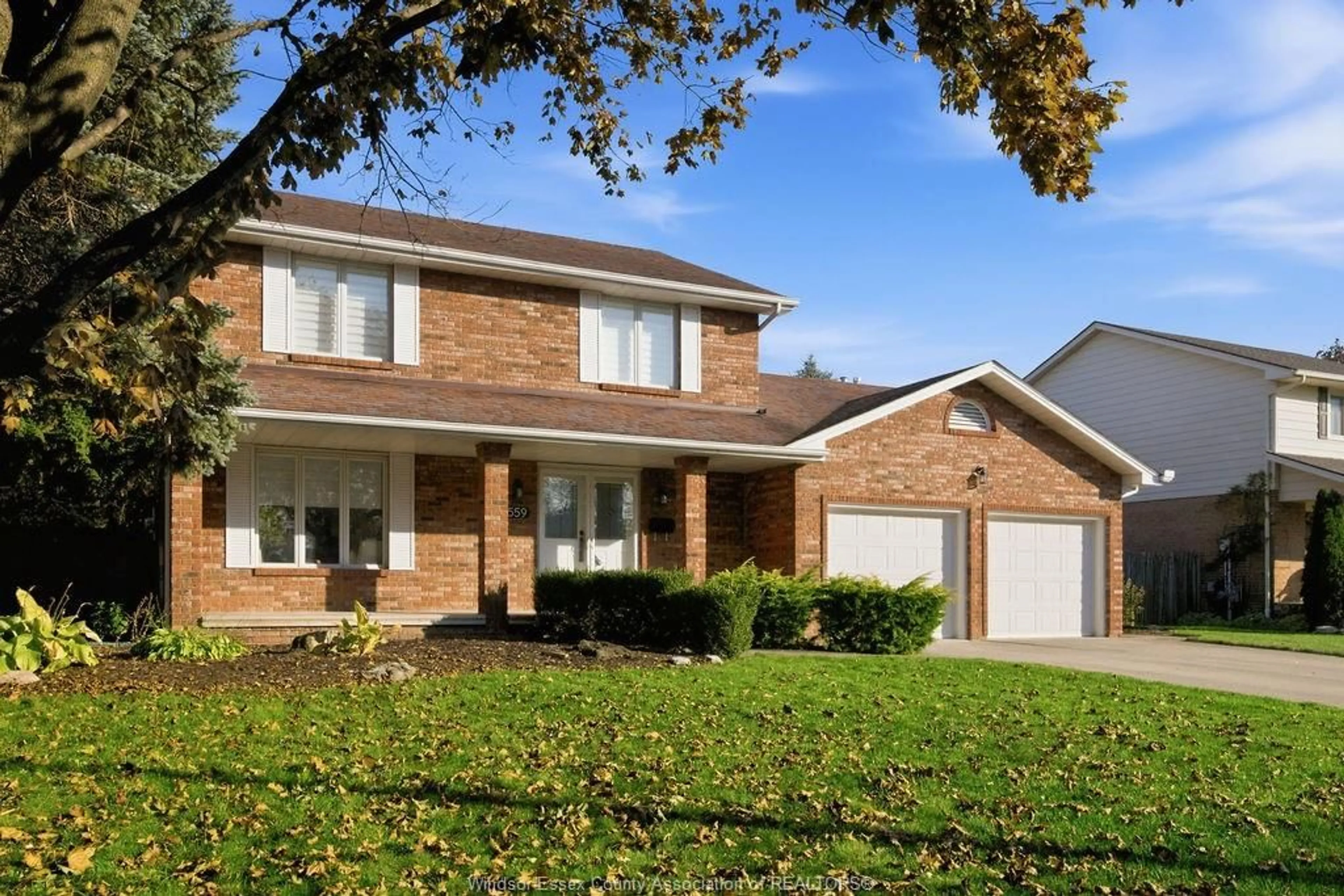 Home with brick exterior material, street for 559 HARBOURNE Cres, Tecumseh Ontario N8N 3J5