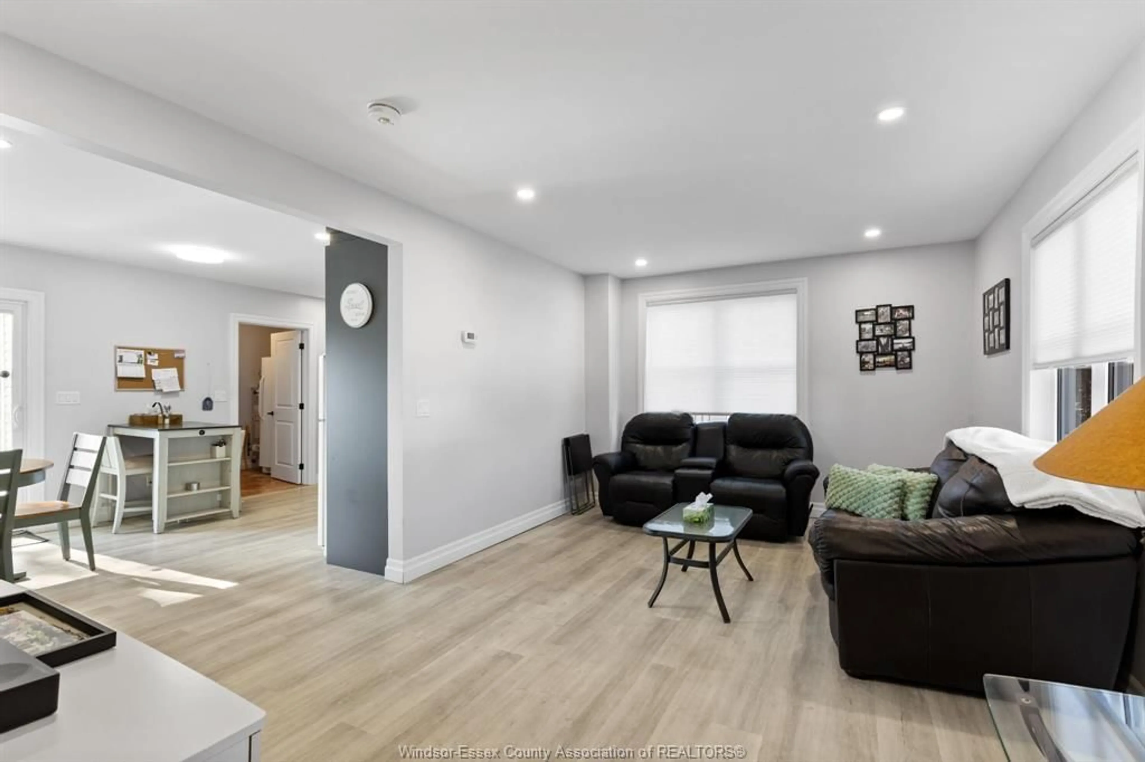 Living room with furniture, wood/laminate floor for 179 SINASAC St, Harrow Ontario N0R 1G0